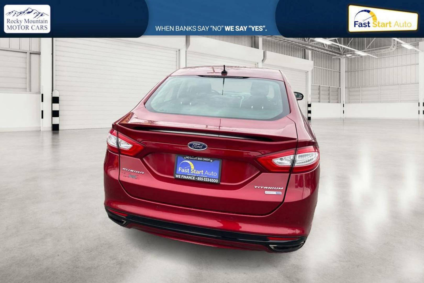 2015 Red Ford Fusion Titanium AWD (3FA6P0D90FR) with an 2.0L L4 DOHC 16V engine, Auto, 6-Spd w/SelShft transmission, located at 767 S State Road, Pleasant Grove, UT, 84062, (801) 785-1058, 40.354839, -111.736687 - Photo#2