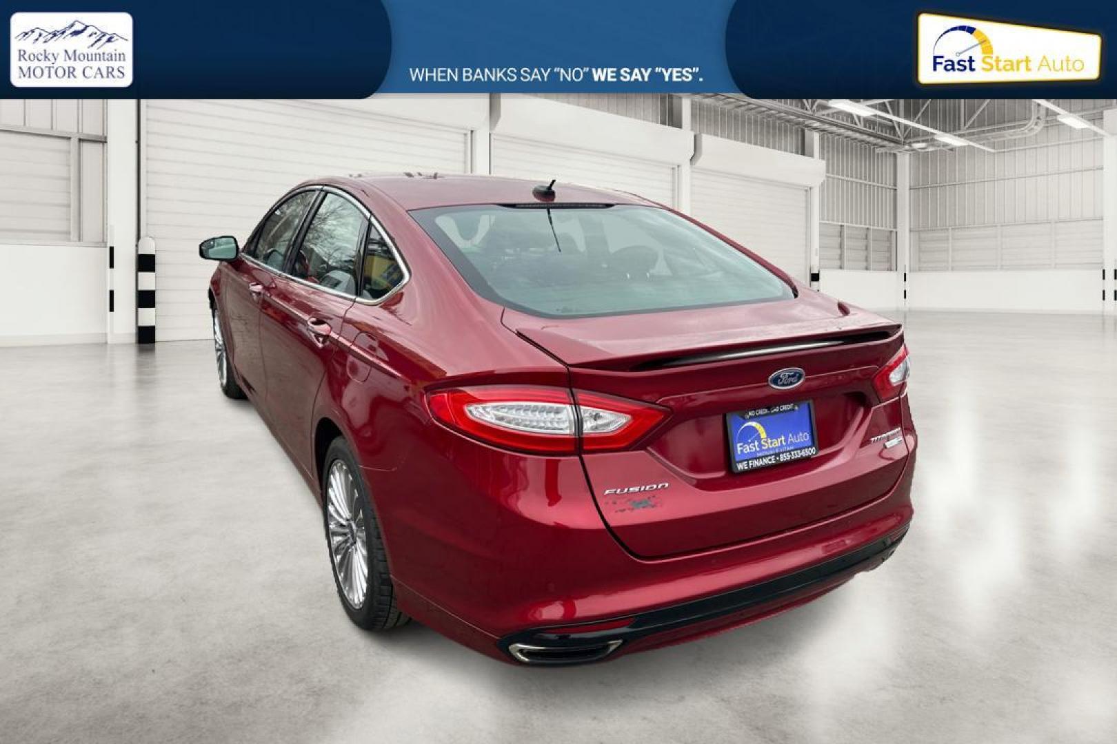 2015 Red Ford Fusion Titanium AWD (3FA6P0D90FR) with an 2.0L L4 DOHC 16V engine, Auto, 6-Spd w/SelShft transmission, located at 767 S State Road, Pleasant Grove, UT, 84062, (801) 785-1058, 40.354839, -111.736687 - Photo#3