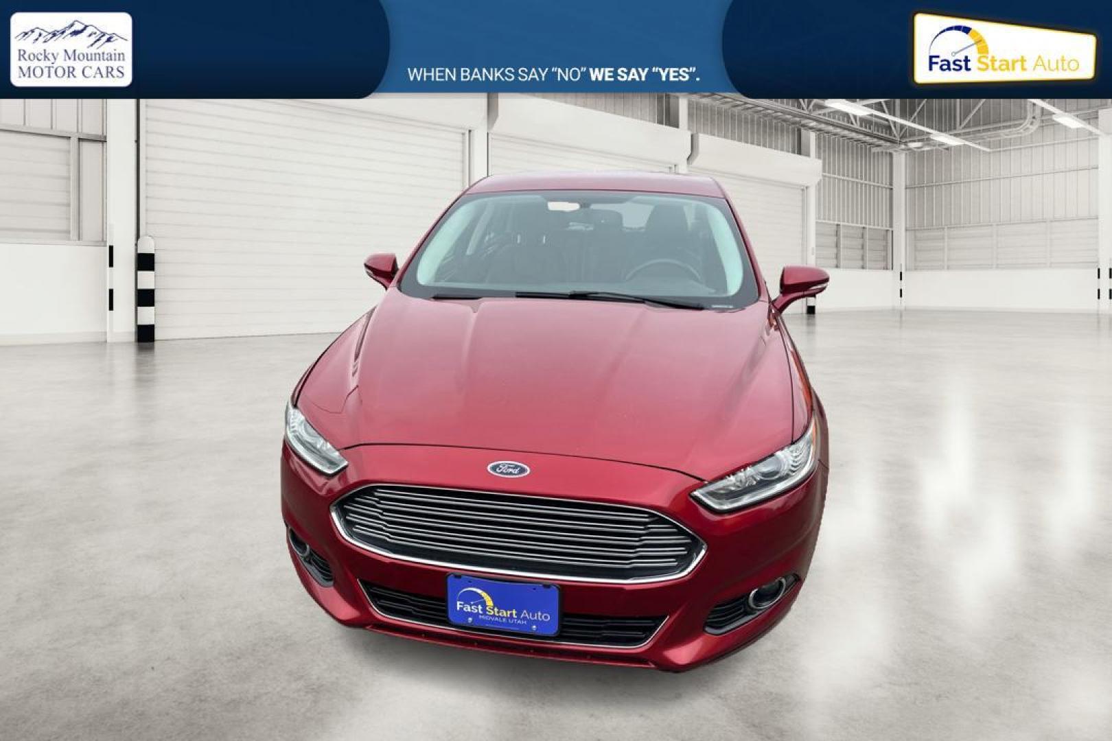 2015 Red Ford Fusion Titanium AWD (3FA6P0D90FR) with an 2.0L L4 DOHC 16V engine, Auto, 6-Spd w/SelShft transmission, located at 767 S State Road, Pleasant Grove, UT, 84062, (801) 785-1058, 40.354839, -111.736687 - Photo#5