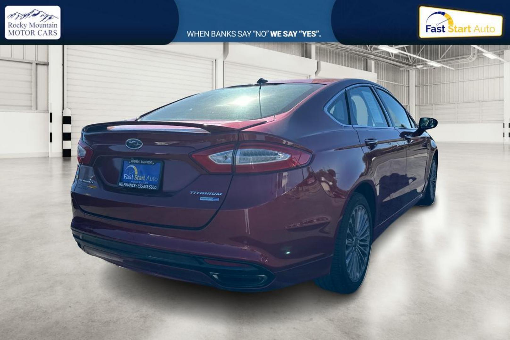 2015 Red Ford Fusion Titanium AWD (3FA6P0D90FR) with an 2.0L L4 DOHC 16V engine, Auto, 6-Spd w/SelShft transmission, located at 7755 State Street, Midvale, UT, 84047, (801) 753-9063, 40.610329, -111.892159 - Photo#2