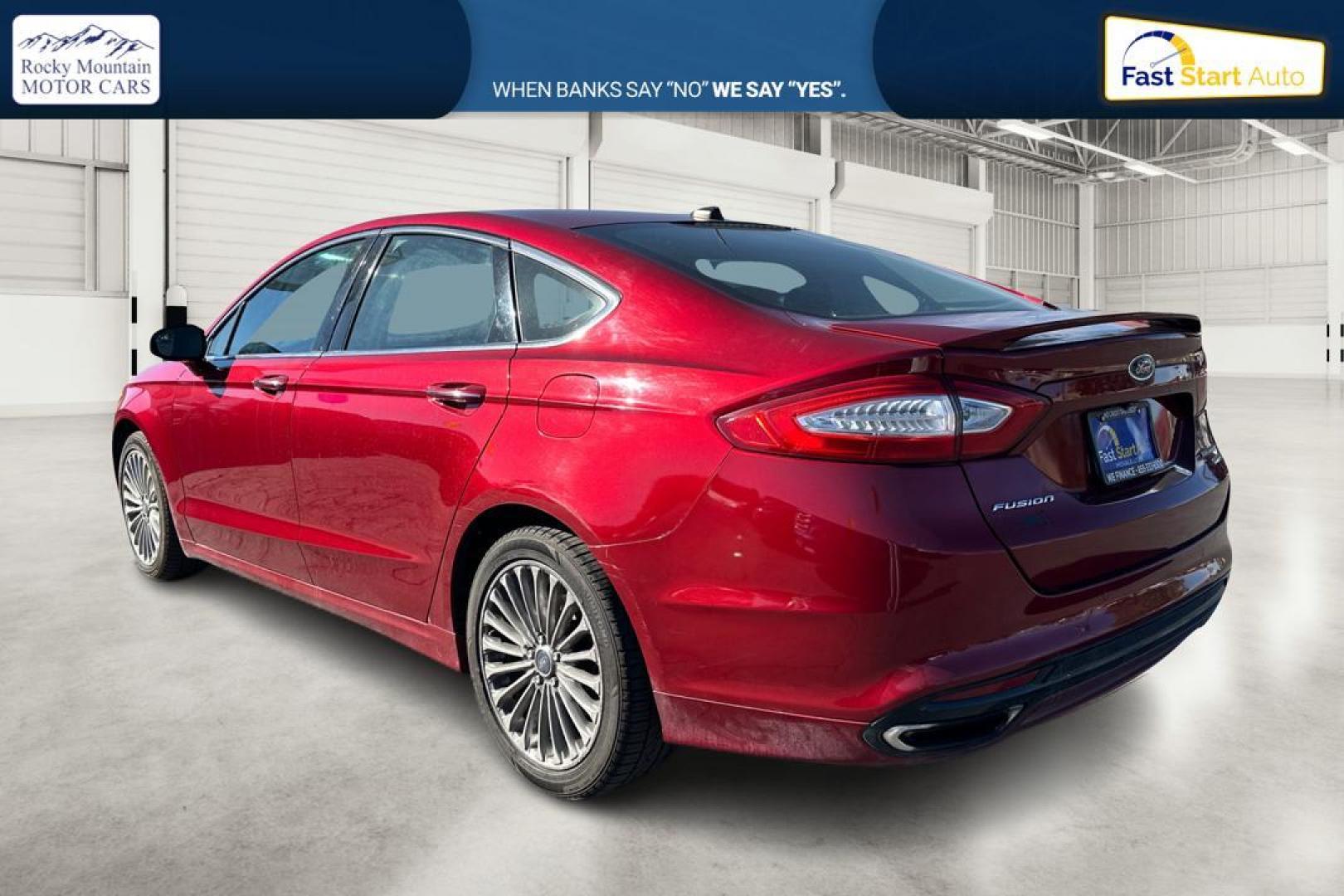 2015 Red Ford Fusion Titanium AWD (3FA6P0D90FR) with an 2.0L L4 DOHC 16V engine, Auto, 6-Spd w/SelShft transmission, located at 7755 State Street, Midvale, UT, 84047, (801) 753-9063, 40.610329, -111.892159 - Photo#5