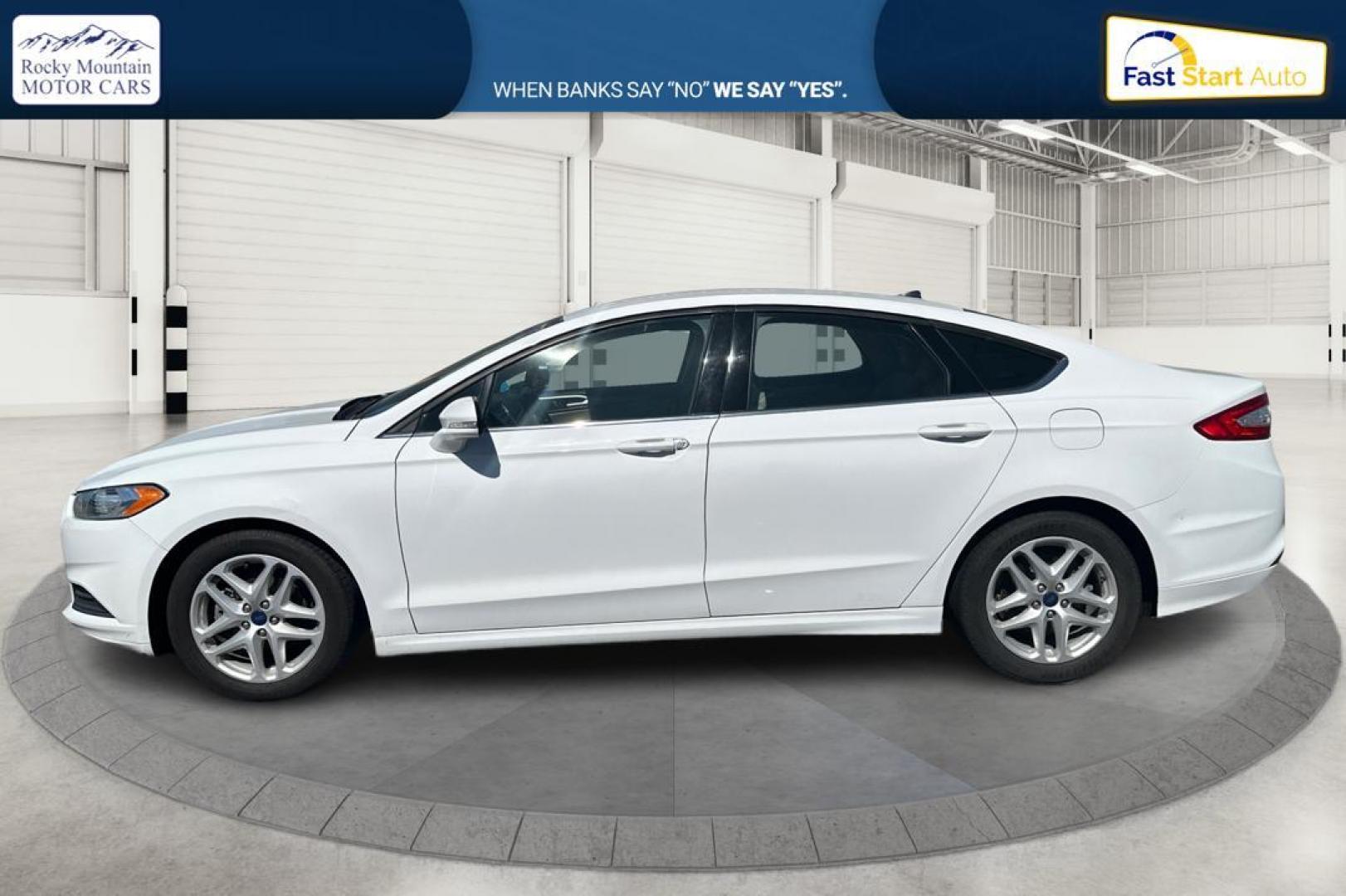 2015 White Ford Fusion SE (3FA6P0H71FR) with an 2.5L L4 DOHC 16V engine, Auto, 6-Spd w/SelShft transmission, located at 344 S Washington Blvd, Ogden, UT, 84404, (801) 399-1799, 41.255482, -111.970848 - Photo#6