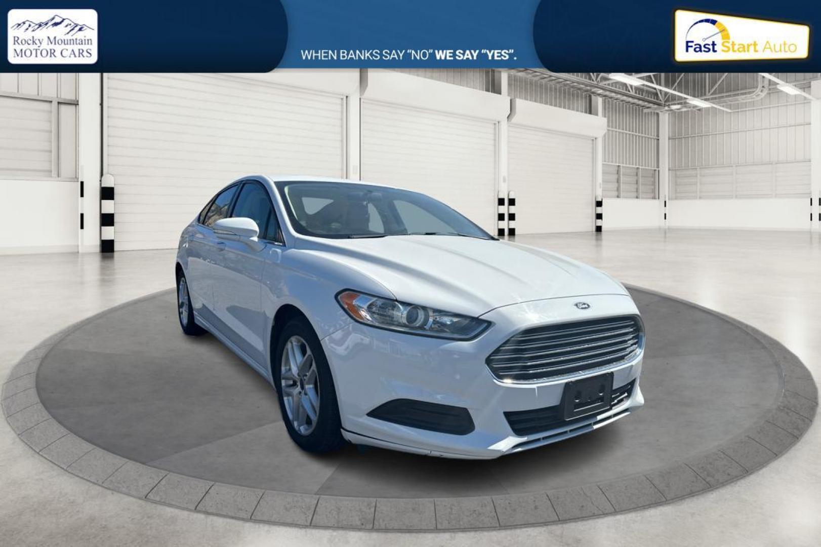 2015 White Ford Fusion SE (3FA6P0H71FR) with an 2.5L L4 DOHC 16V engine, Auto, 6-Spd w/SelShft transmission, located at 344 S Washington Blvd, Ogden, UT, 84404, (801) 399-1799, 41.255482, -111.970848 - Photo#0