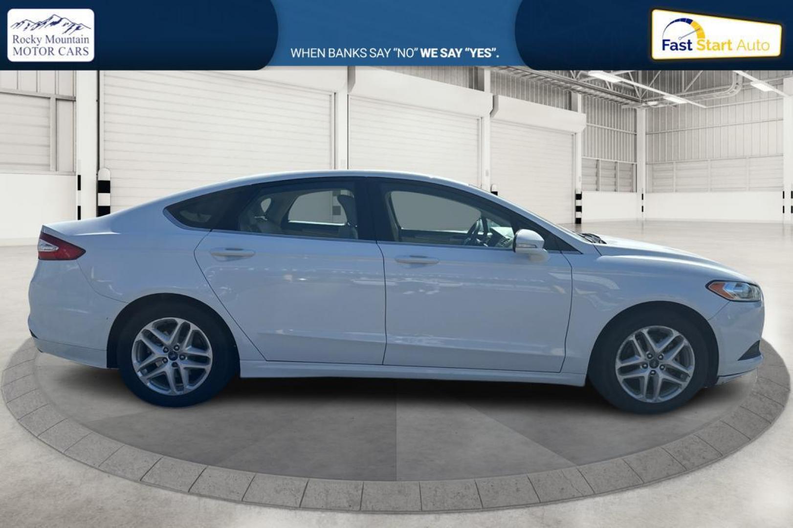 2015 White Ford Fusion SE (3FA6P0H71FR) with an 2.5L L4 DOHC 16V engine, Auto, 6-Spd w/SelShft transmission, located at 344 S Washington Blvd, Ogden, UT, 84404, (801) 399-1799, 41.255482, -111.970848 - Photo#1