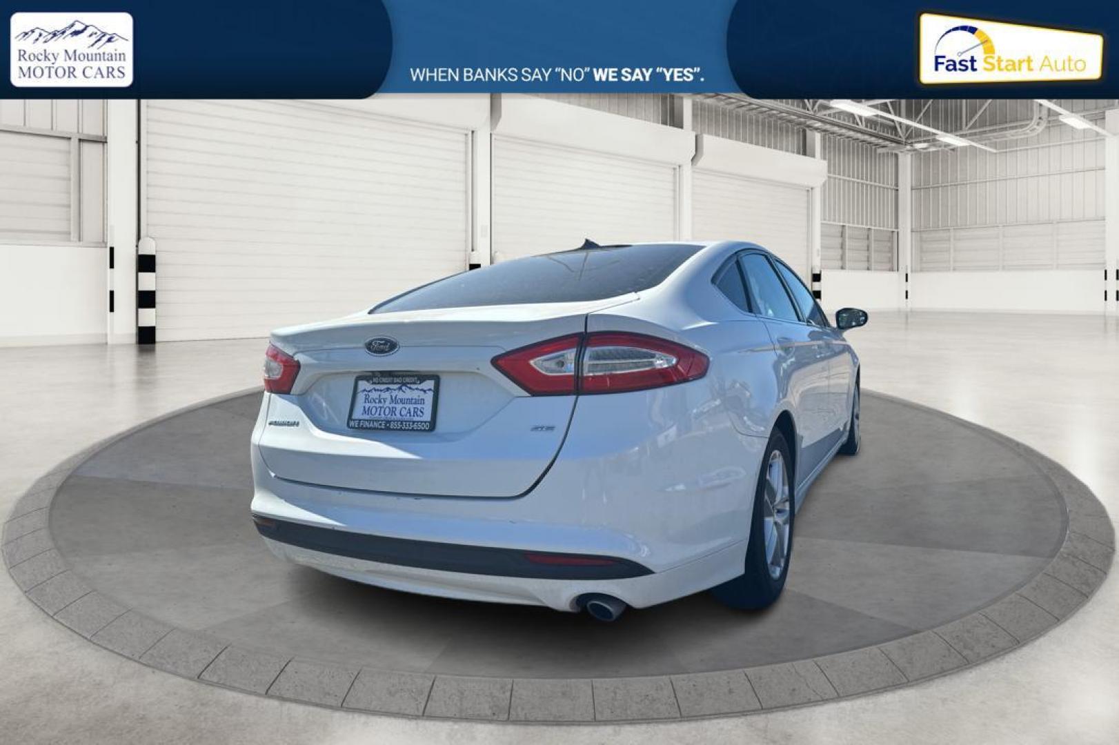 2015 White Ford Fusion SE (3FA6P0H71FR) with an 2.5L L4 DOHC 16V engine, Auto, 6-Spd w/SelShft transmission, located at 344 S Washington Blvd, Ogden, UT, 84404, (801) 399-1799, 41.255482, -111.970848 - Photo#2