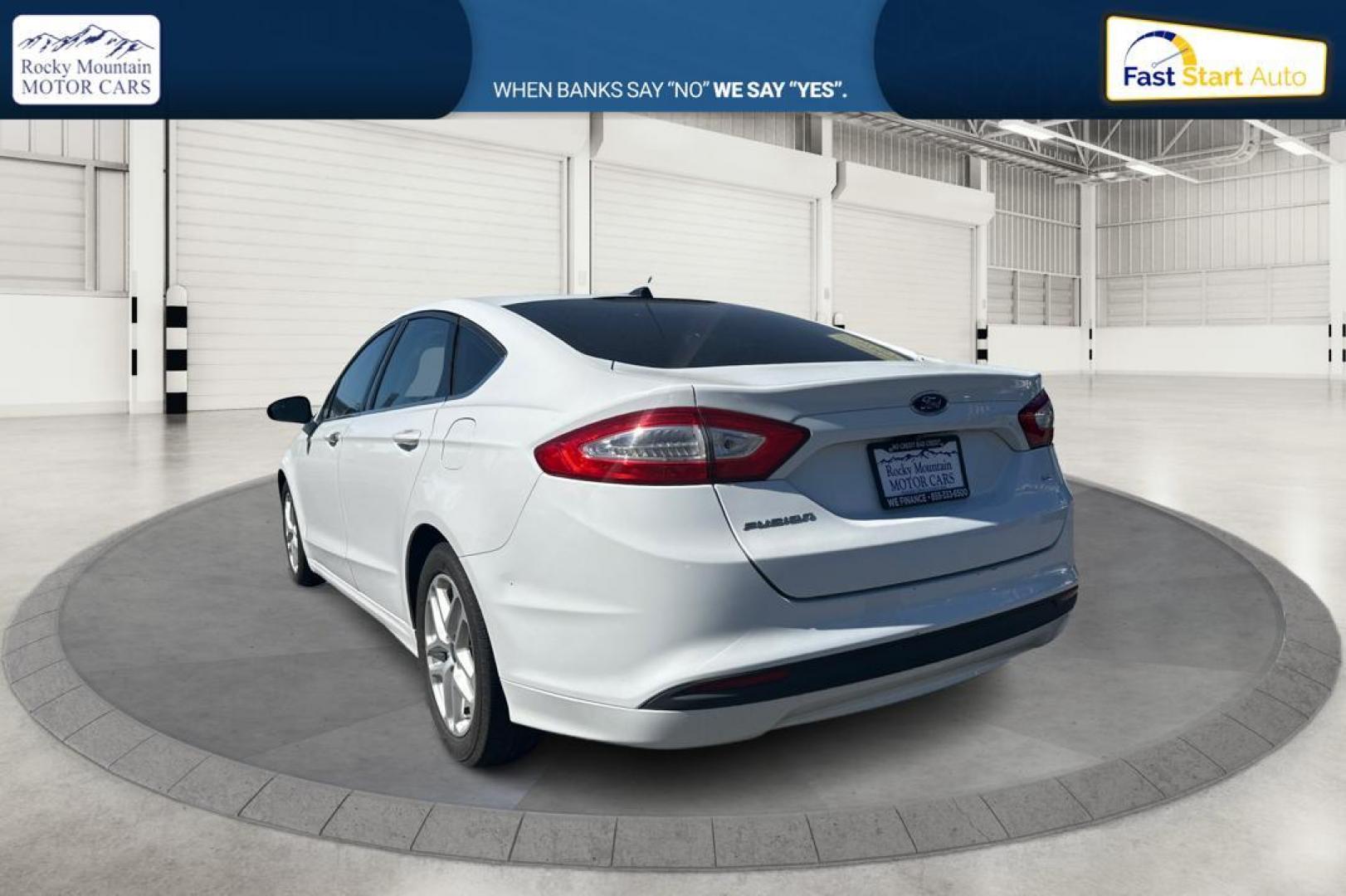 2015 White Ford Fusion SE (3FA6P0H71FR) with an 2.5L L4 DOHC 16V engine, Auto, 6-Spd w/SelShft transmission, located at 344 S Washington Blvd, Ogden, UT, 84404, (801) 399-1799, 41.255482, -111.970848 - Photo#5