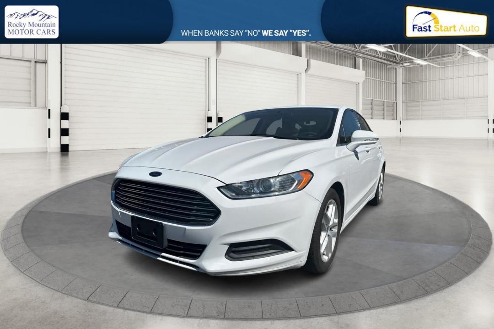 2015 White Ford Fusion SE (3FA6P0H71FR) with an 2.5L L4 DOHC 16V engine, Auto, 6-Spd w/SelShft transmission, located at 344 S Washington Blvd, Ogden, UT, 84404, (801) 399-1799, 41.255482, -111.970848 - Photo#8