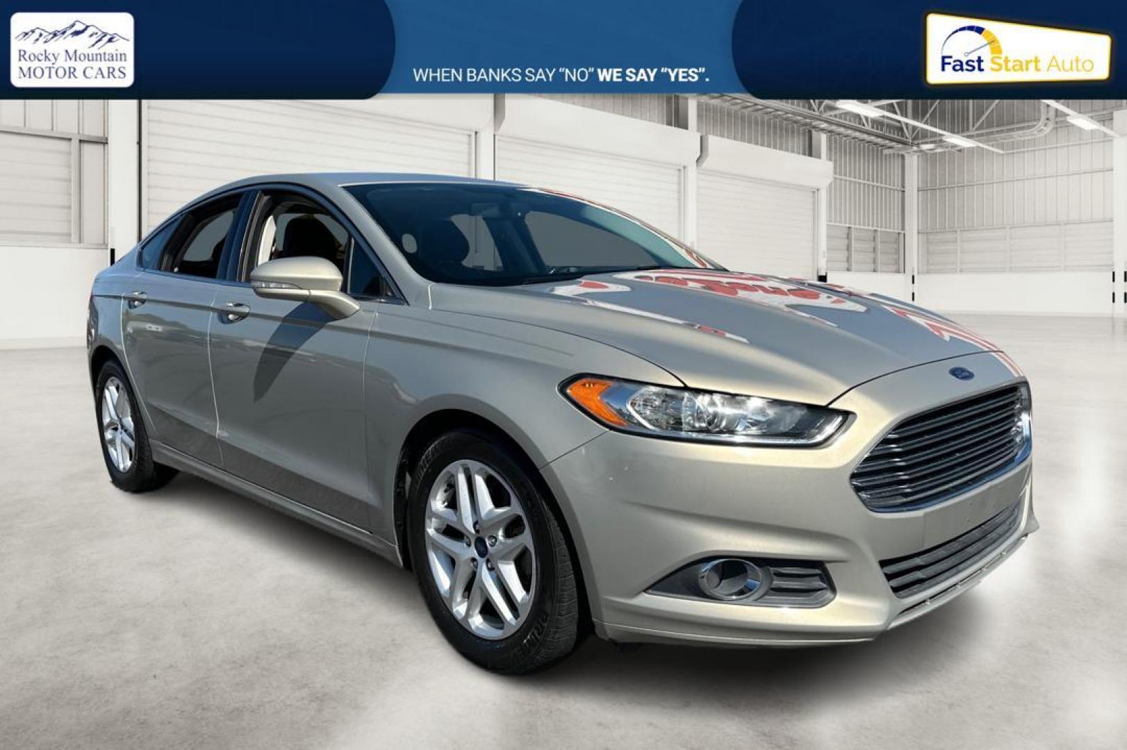 2015 Gray Ford Fusion SE (3FA6P0HDXFR) with an 1.5L L4 DOHC 16V engine, Auto, 6-Spd w/SelShft transmission, located at 344 S Washington Blvd, Ogden, UT, 84404, (801) 399-1799, 41.255482, -111.970848 - Photo#0