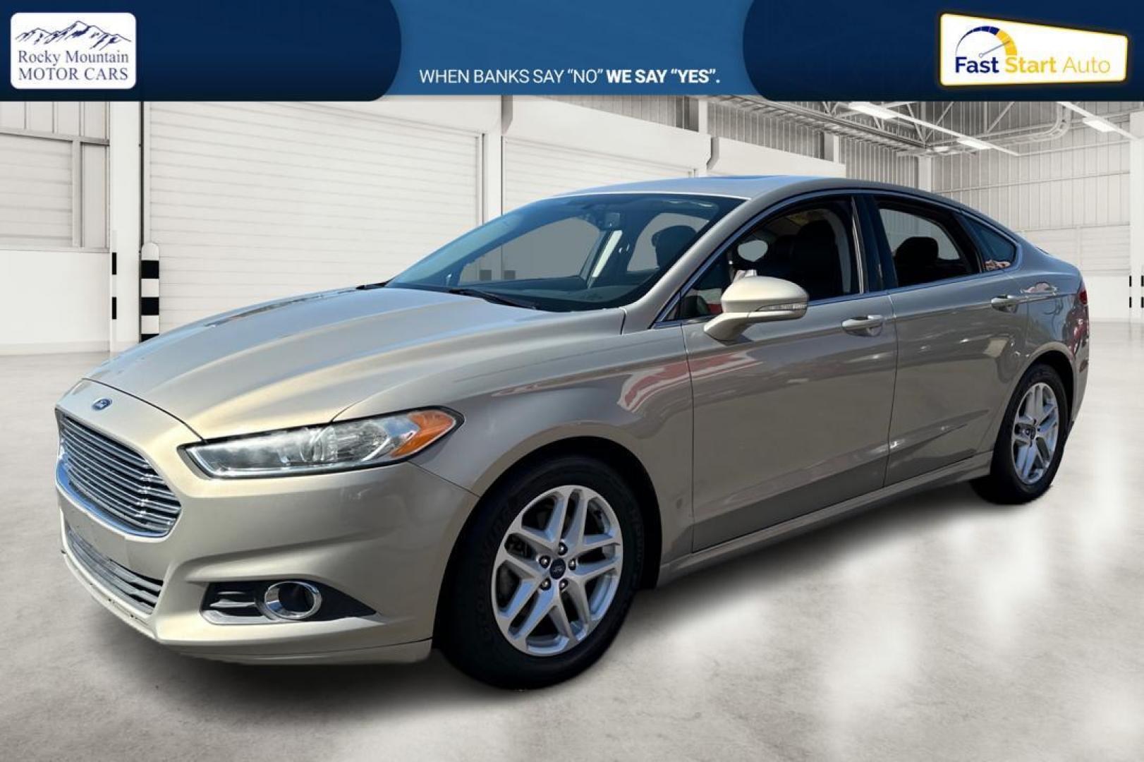 2015 Gray Ford Fusion SE (3FA6P0HDXFR) with an 1.5L L4 DOHC 16V engine, Auto, 6-Spd w/SelShft transmission, located at 344 S Washington Blvd, Ogden, UT, 84404, (801) 399-1799, 41.255482, -111.970848 - Photo#6