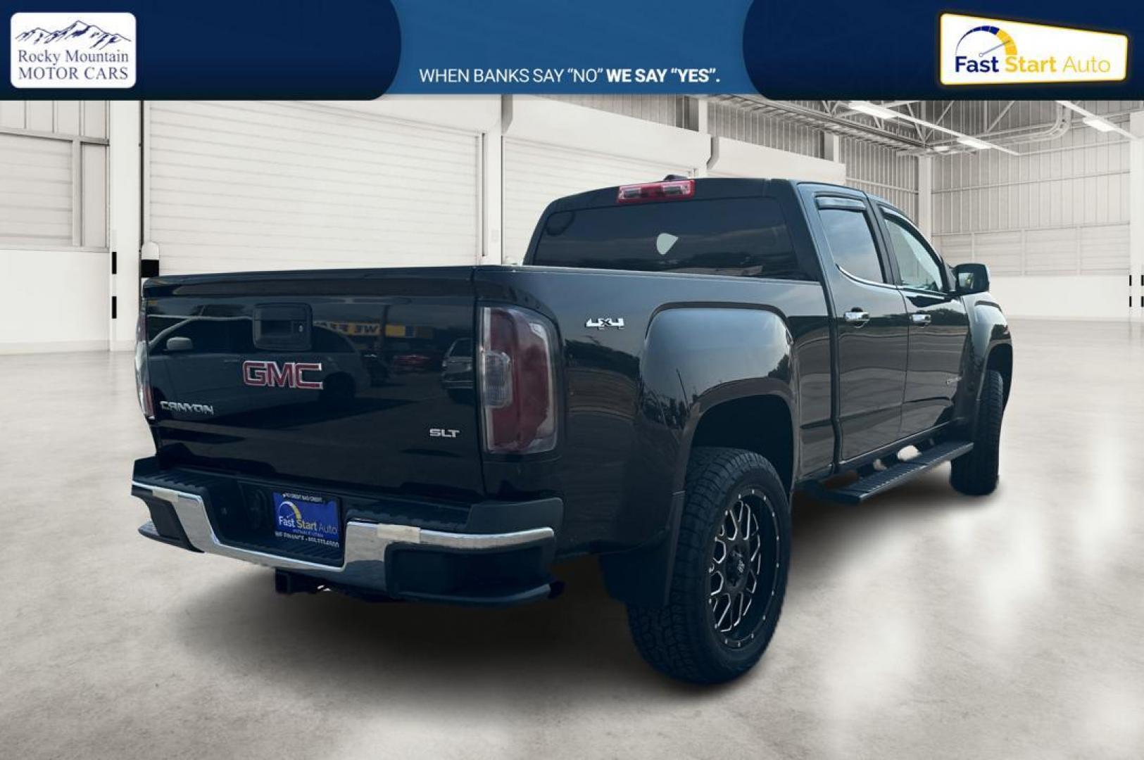 2015 Black GMC Canyon SLT Crew Cab 4WD Short Box (1GTG6CE36F1) with an 3.6L V6 DOHC 24V engine, 6-Speed Automatic transmission, located at 344 S Washington Blvd, Ogden, UT, 84404, (801) 399-1799, 41.255482, -111.970848 - Photo#2