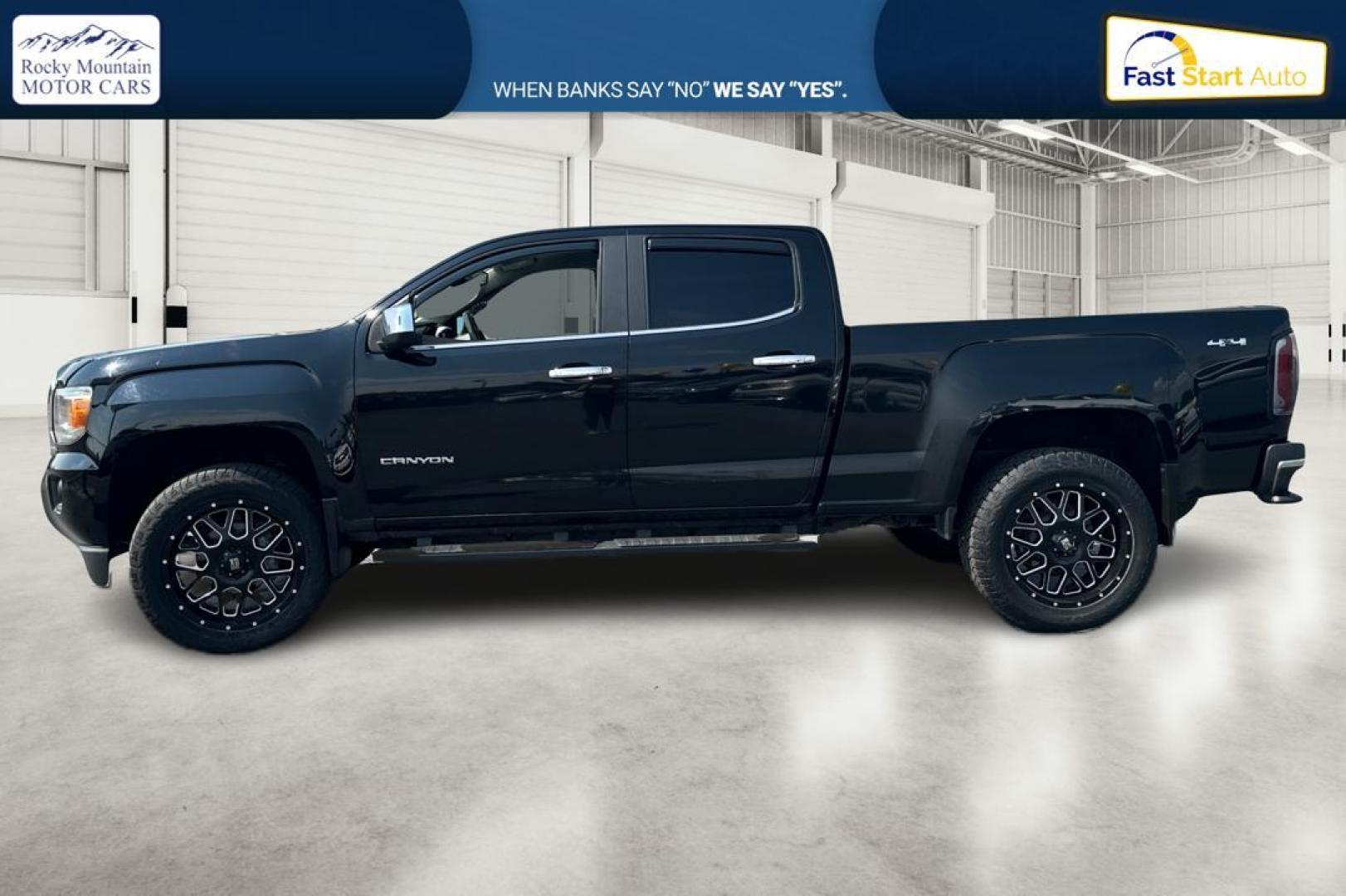 2015 Black GMC Canyon SLT Crew Cab 4WD Short Box (1GTG6CE36F1) with an 3.6L V6 DOHC 24V engine, 6-Speed Automatic transmission, located at 344 S Washington Blvd, Ogden, UT, 84404, (801) 399-1799, 41.255482, -111.970848 - Photo#5