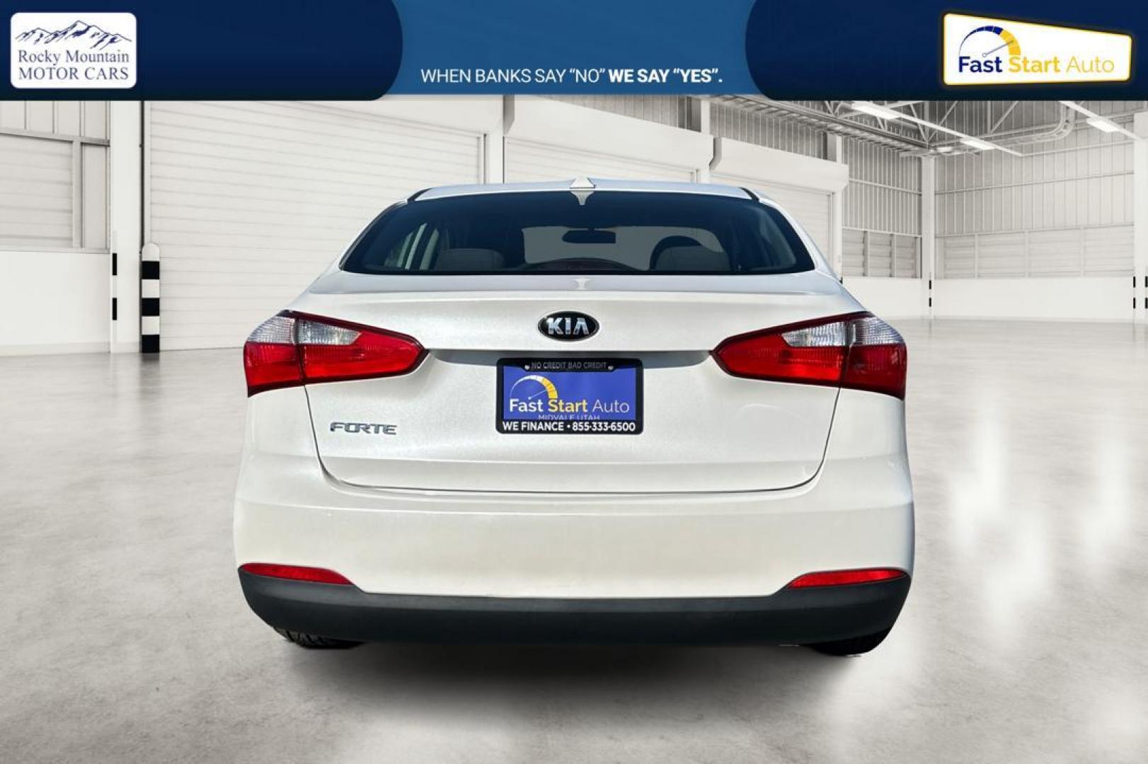 2015 White Kia Forte EX (KNAFX4A61F5) with an 1.8L L4 DOHC 16V engine, 6-Speed Automatic transmission, located at 767 S State Road, Pleasant Grove, UT, 84062, (801) 785-1058, 40.354839, -111.736687 - Photo#4