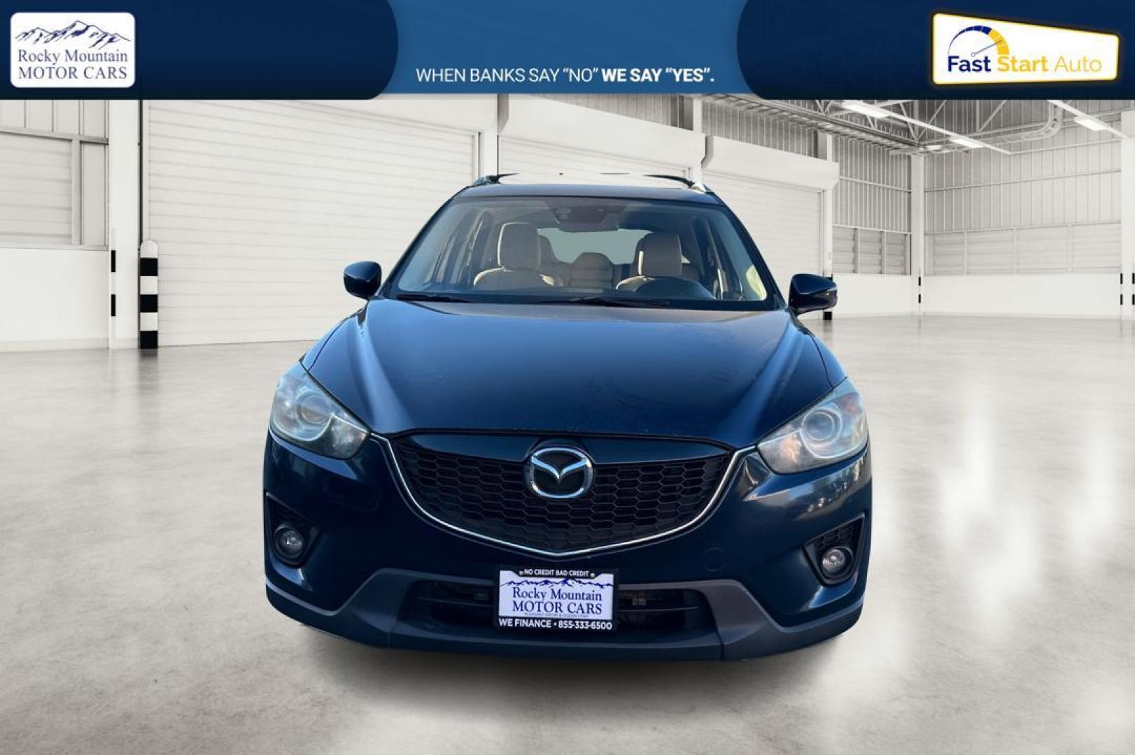 2015 Blue Mazda CX-5 Grand Touring (JM3KE2DY5F0) with an 2.5L L4 DOHC 16V engine, 6-Speed Automatic transmission, located at 344 S Washington Blvd, Ogden, UT, 84404, (801) 399-1799, 41.255482, -111.970848 - Photo#9