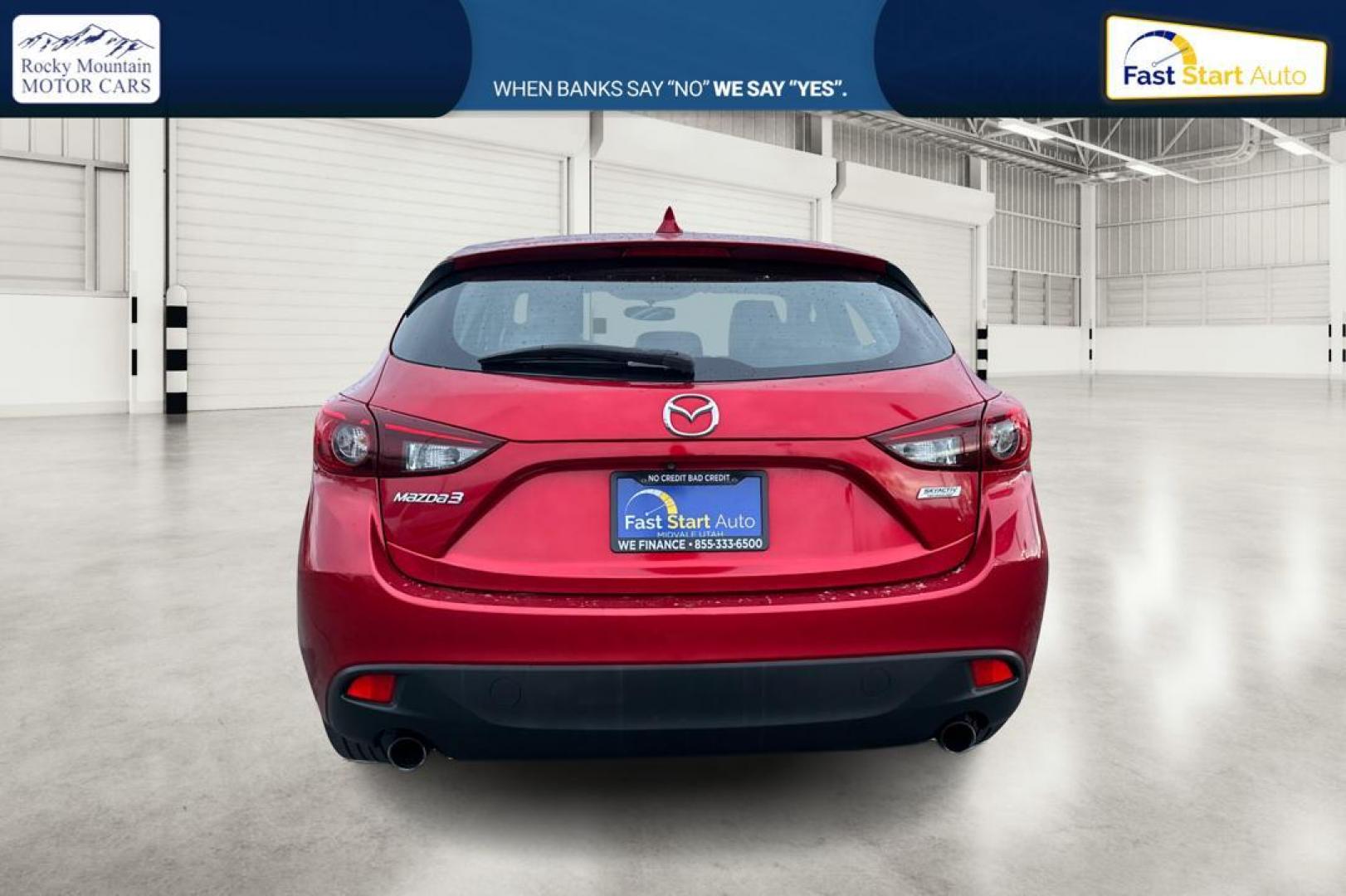 2015 Red Mazda MAZDA3 i Grand Touring AT 5-Door (JM1BM1M75F1) with an 2.0L L4 DOHC 16V engine, 6-Speed Automatic transmission, located at 7755 State Street, Midvale, UT, 84047, (801) 753-9063, 40.610329, -111.892159 - Photo#4