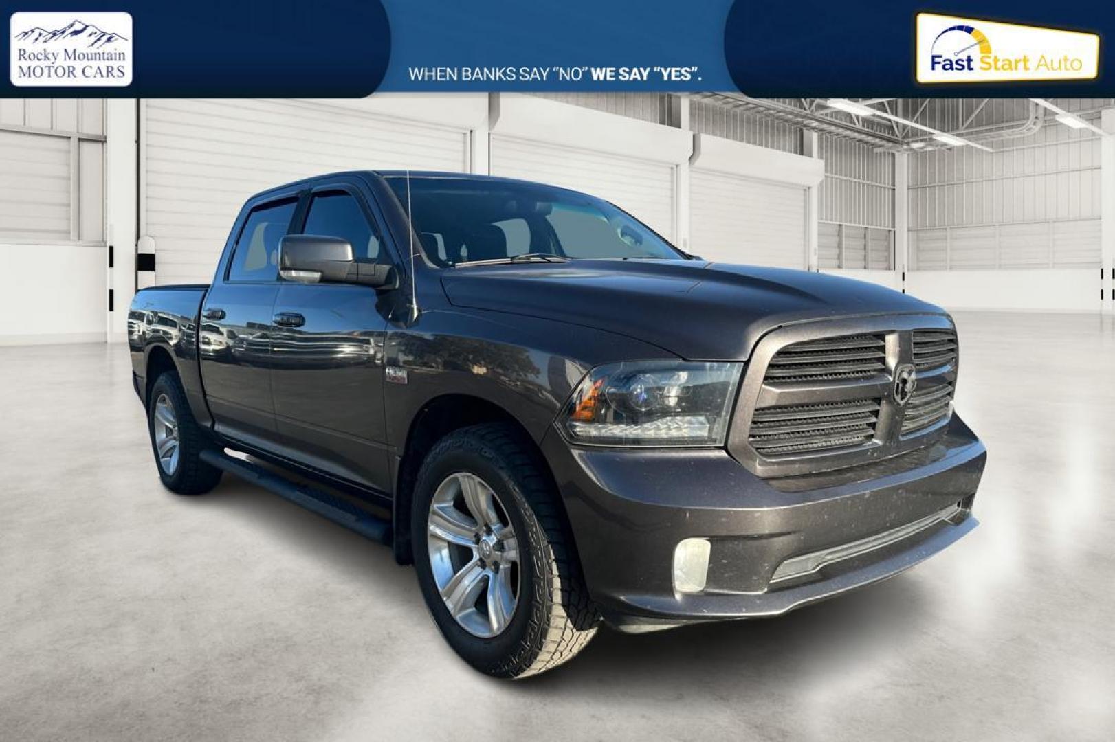 2015 Gray RAM 1500 Sport Crew Cab SWB 4WD (1C6RR7MT1FS) with an 5.7L V8 OHV 16V engine, 6-Speed Automatic transmission, located at 344 S Washington Blvd, Ogden, UT, 84404, (801) 399-1799, 41.255482, -111.970848 - Photo#0