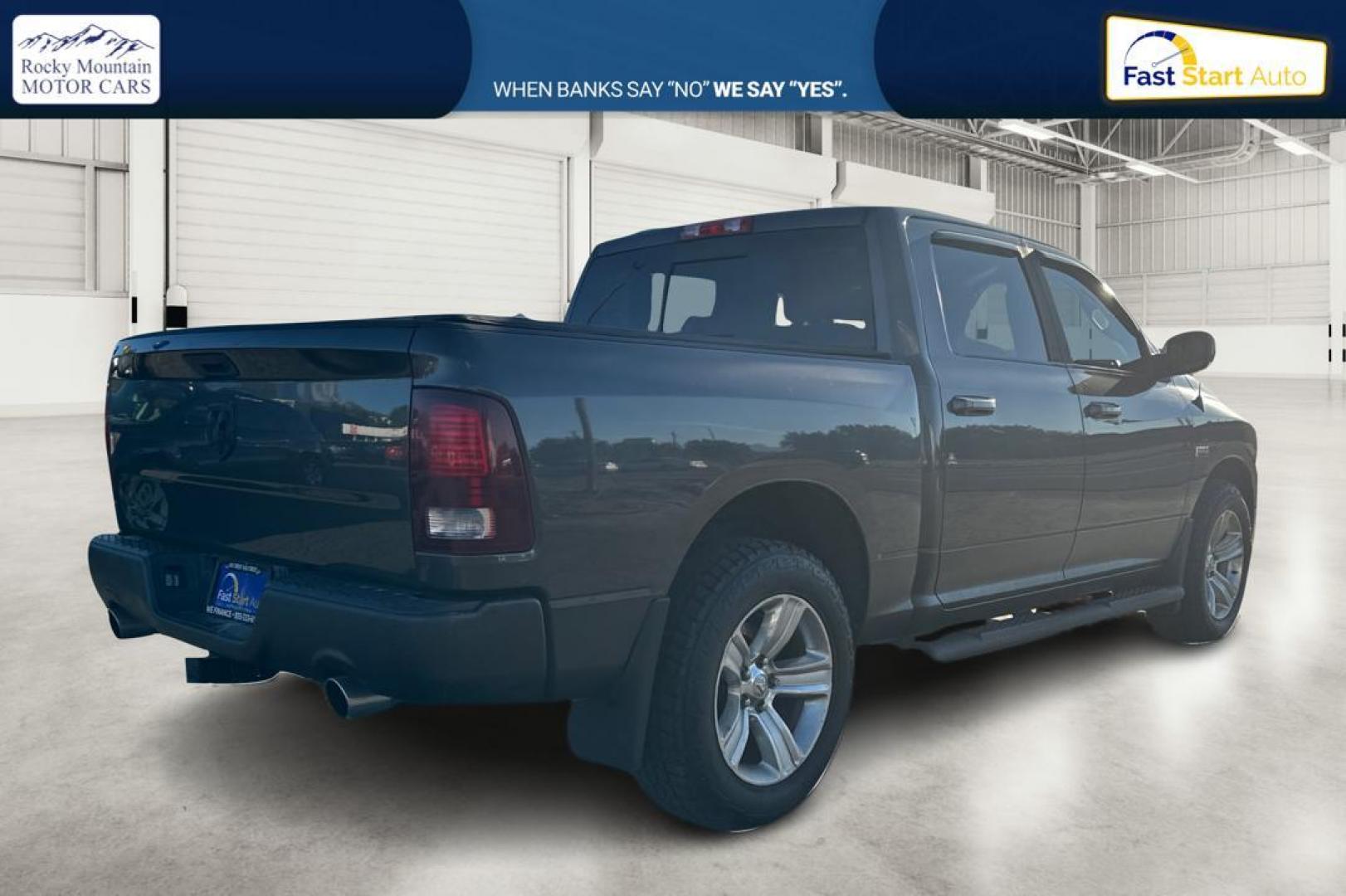 2015 Gray RAM 1500 Sport Crew Cab SWB 4WD (1C6RR7MT1FS) with an 5.7L V8 OHV 16V engine, 6-Speed Automatic transmission, located at 344 S Washington Blvd, Ogden, UT, 84404, (801) 399-1799, 41.255482, -111.970848 - Photo#2