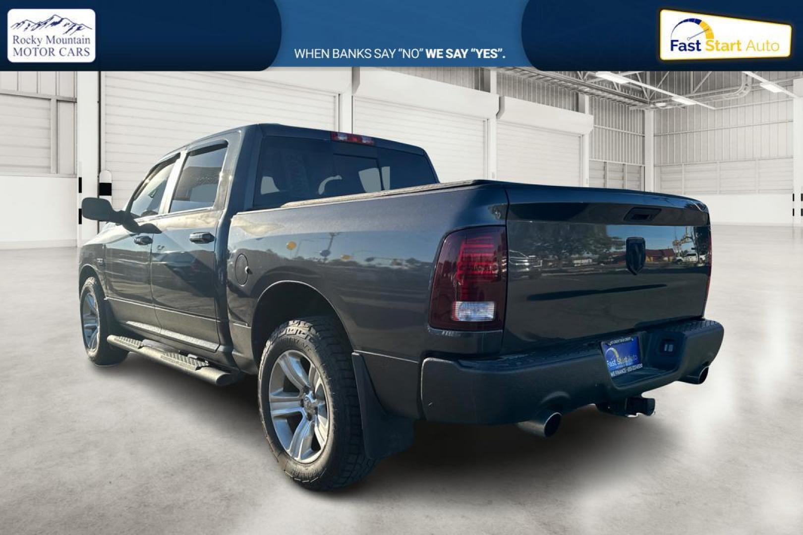 2015 Gray RAM 1500 Sport Crew Cab SWB 4WD (1C6RR7MT1FS) with an 5.7L V8 OHV 16V engine, 6-Speed Automatic transmission, located at 344 S Washington Blvd, Ogden, UT, 84404, (801) 399-1799, 41.255482, -111.970848 - Photo#5