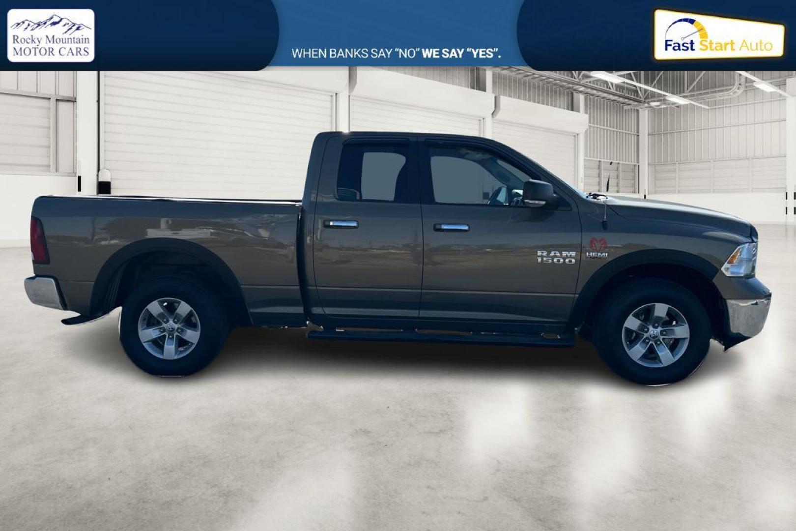 2015 Gold RAM 1500 SLT Quad Cab 4WD (1C6RR7GT8FS) with an 5.7L V8 OHV 16V engine, 6-Speed Automatic transmission, located at 7755 State Street, Midvale, UT, 84047, (801) 753-9063, 40.610329, -111.892159 - Photo#1