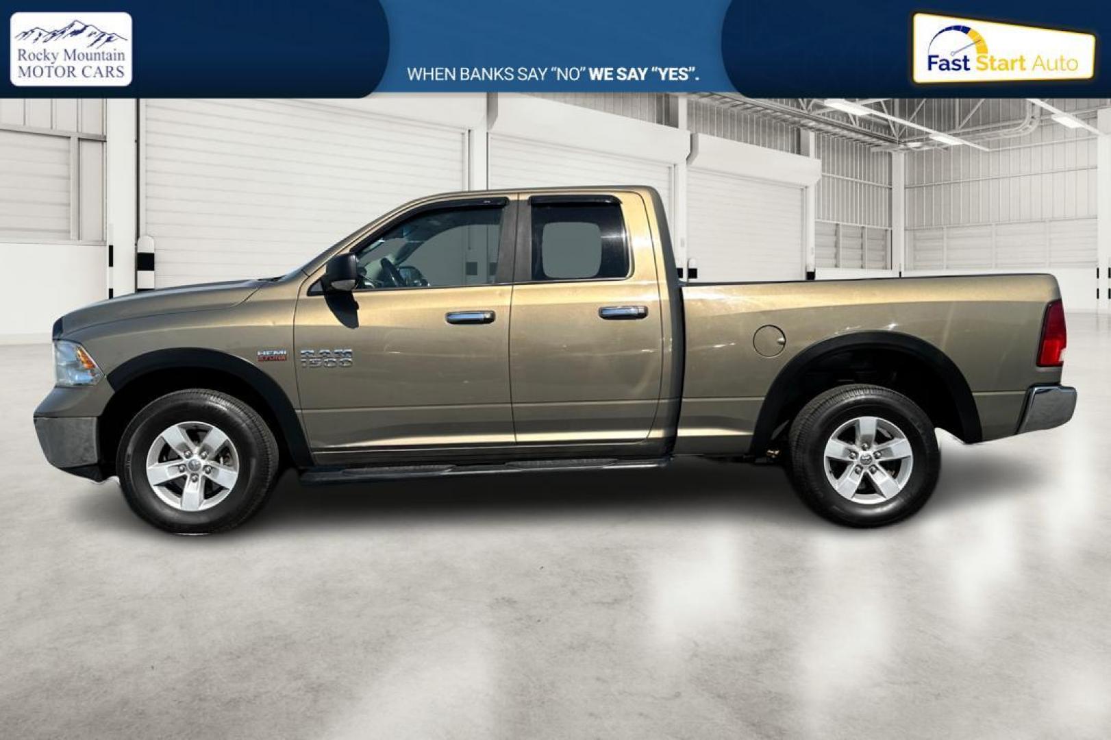 2015 Gold RAM 1500 SLT Quad Cab 4WD (1C6RR7GT8FS) with an 5.7L V8 OHV 16V engine, 6-Speed Automatic transmission, located at 7755 State Street, Midvale, UT, 84047, (801) 753-9063, 40.610329, -111.892159 - Photo#6