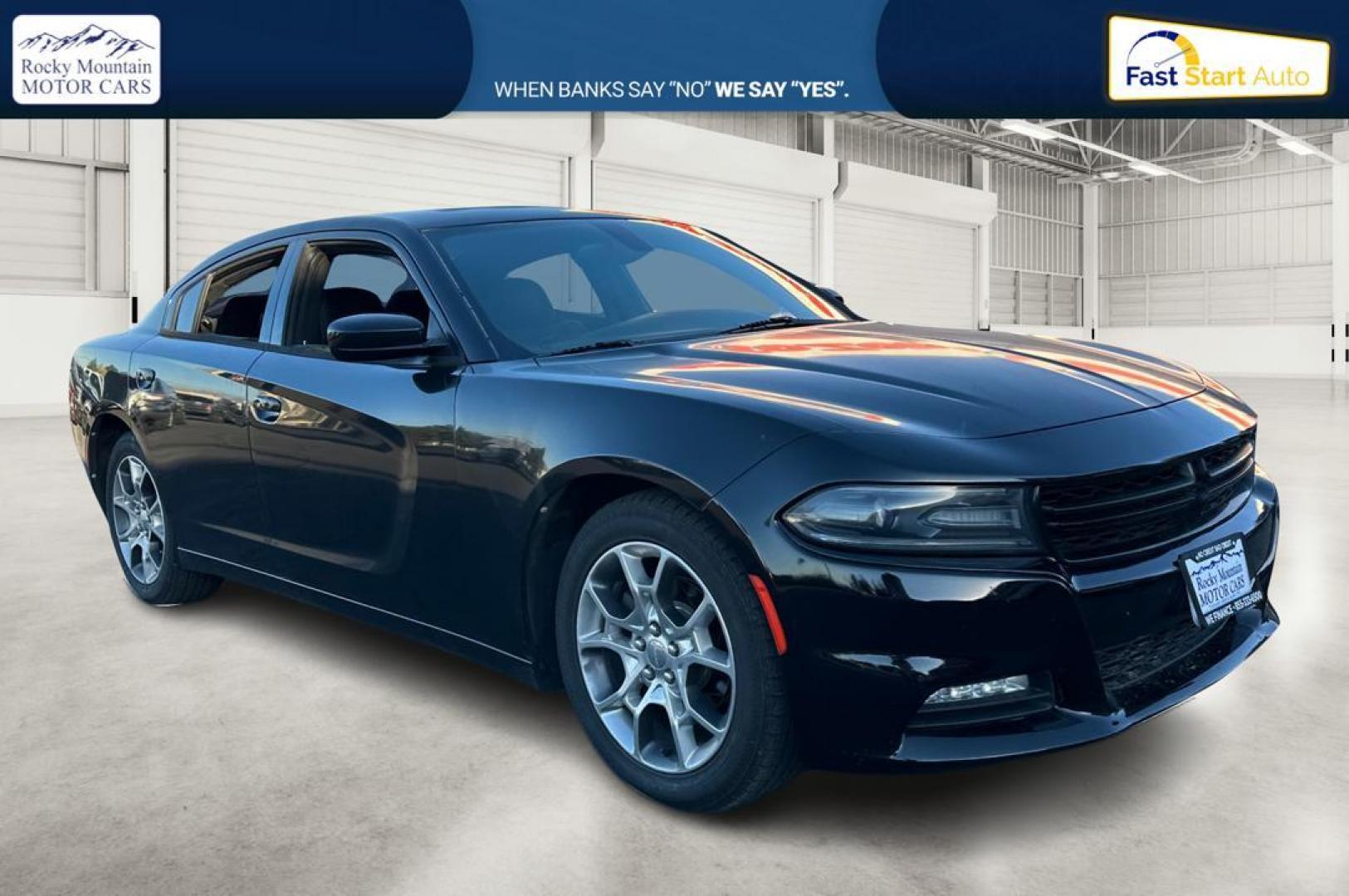 2016 Black Dodge Charger SXT (2C3CDXHG9GH) with an 3.6L V6 DOHC 24V engine, 8A transmission, located at 344 S Washington Blvd, Ogden, UT, 84404, (801) 399-1799, 41.255482, -111.970848 - Photo#0