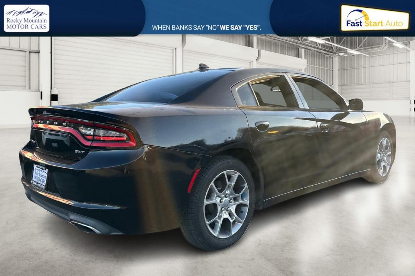 2016 Black Dodge Charger SXT (2C3CDXHG9GH) with an 3.6L V6 DOHC 24V engine, 8A transmission, located at 344 S Washington Blvd, Ogden, UT, 84404, (801) 399-1799, 41.255482, -111.970848 - Photo#2