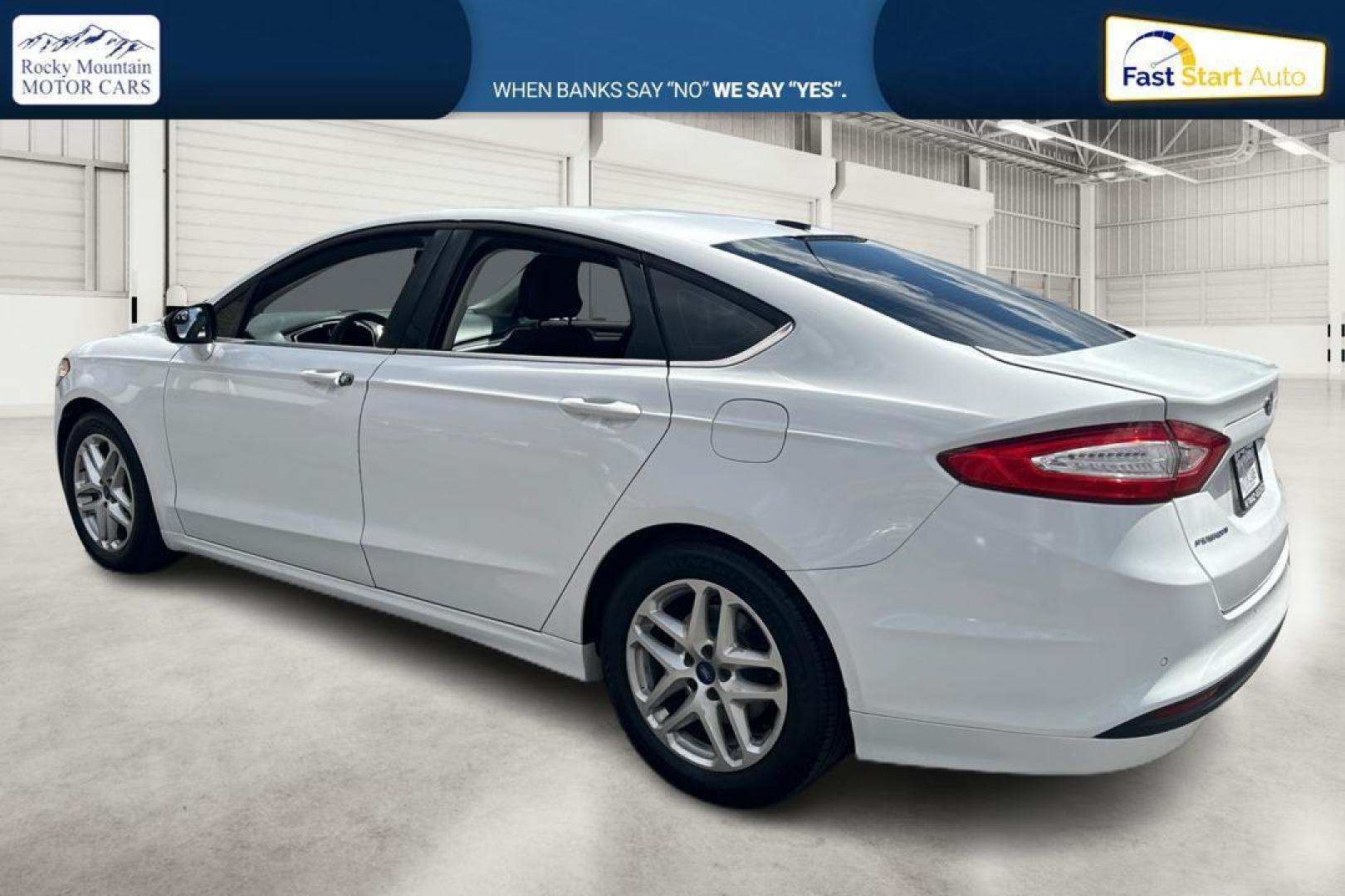 2016 White Ford Fusion SE (3FA6P0HD1GR) with an 1.5L L4 DOHC 16V engine, 6-Speed Automatic transmission, located at 767 S State Road, Pleasant Grove, UT, 84062, (801) 785-1058, 40.354839, -111.736687 - Photo#4