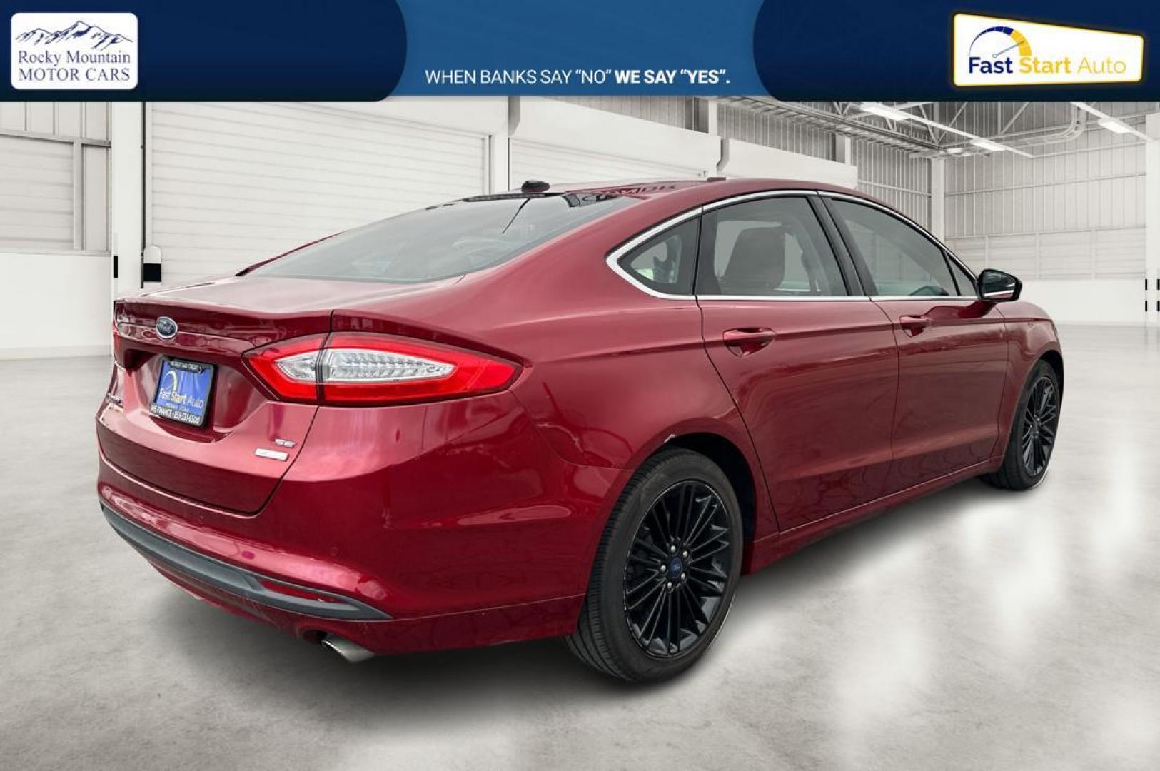 2016 Red Ford Fusion SE (1FA6P0HD4G5) with an 1.5L L4 DOHC 16V engine, 6-Speed Automatic transmission, located at 344 S Washington Blvd, Ogden, UT, 84404, (801) 399-1799, 41.255482, -111.970848 - Photo#2