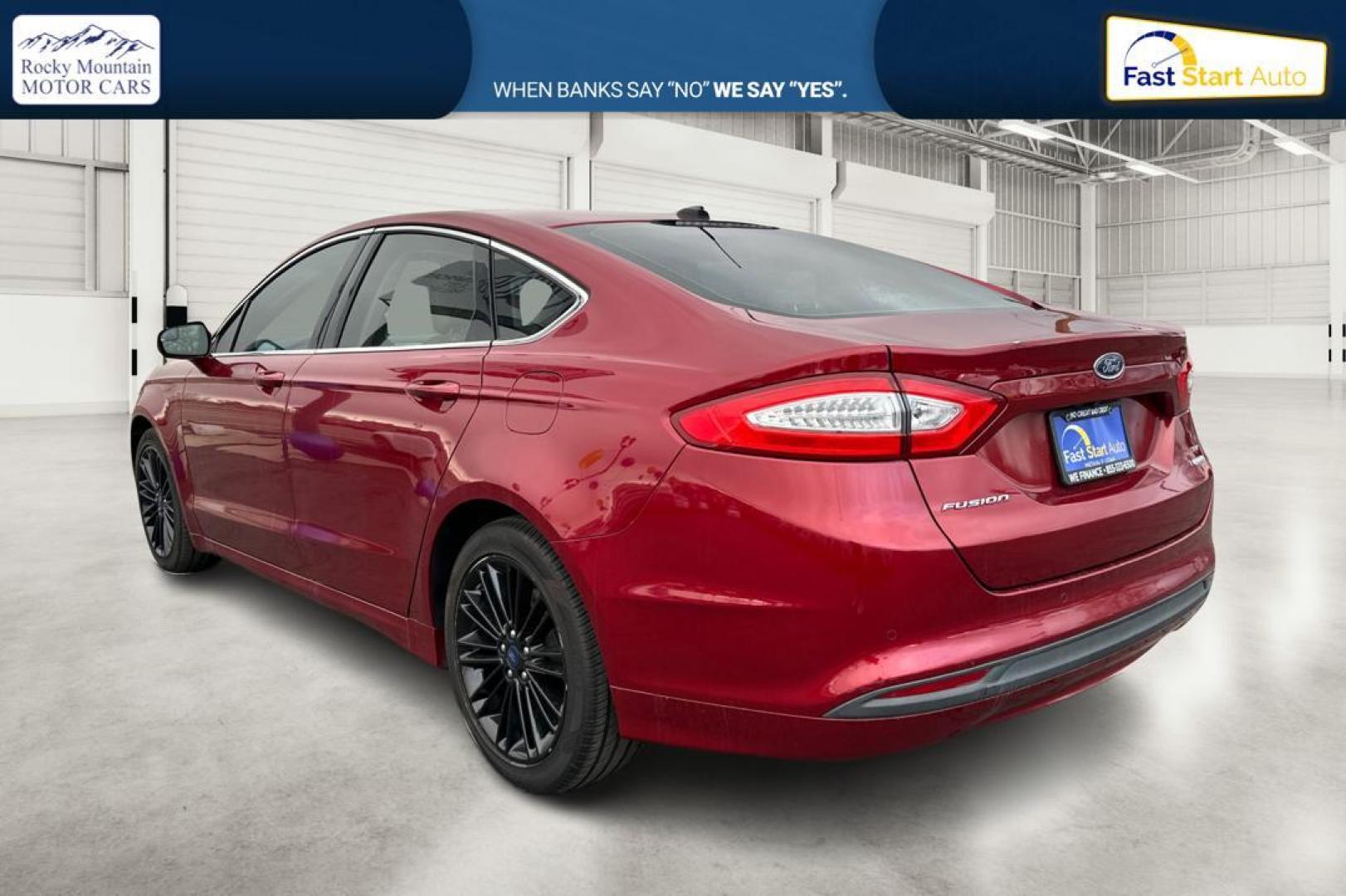 2016 Red Ford Fusion SE (1FA6P0HD4G5) with an 1.5L L4 DOHC 16V engine, 6-Speed Automatic transmission, located at 344 S Washington Blvd, Ogden, UT, 84404, (801) 399-1799, 41.255482, -111.970848 - Photo#5