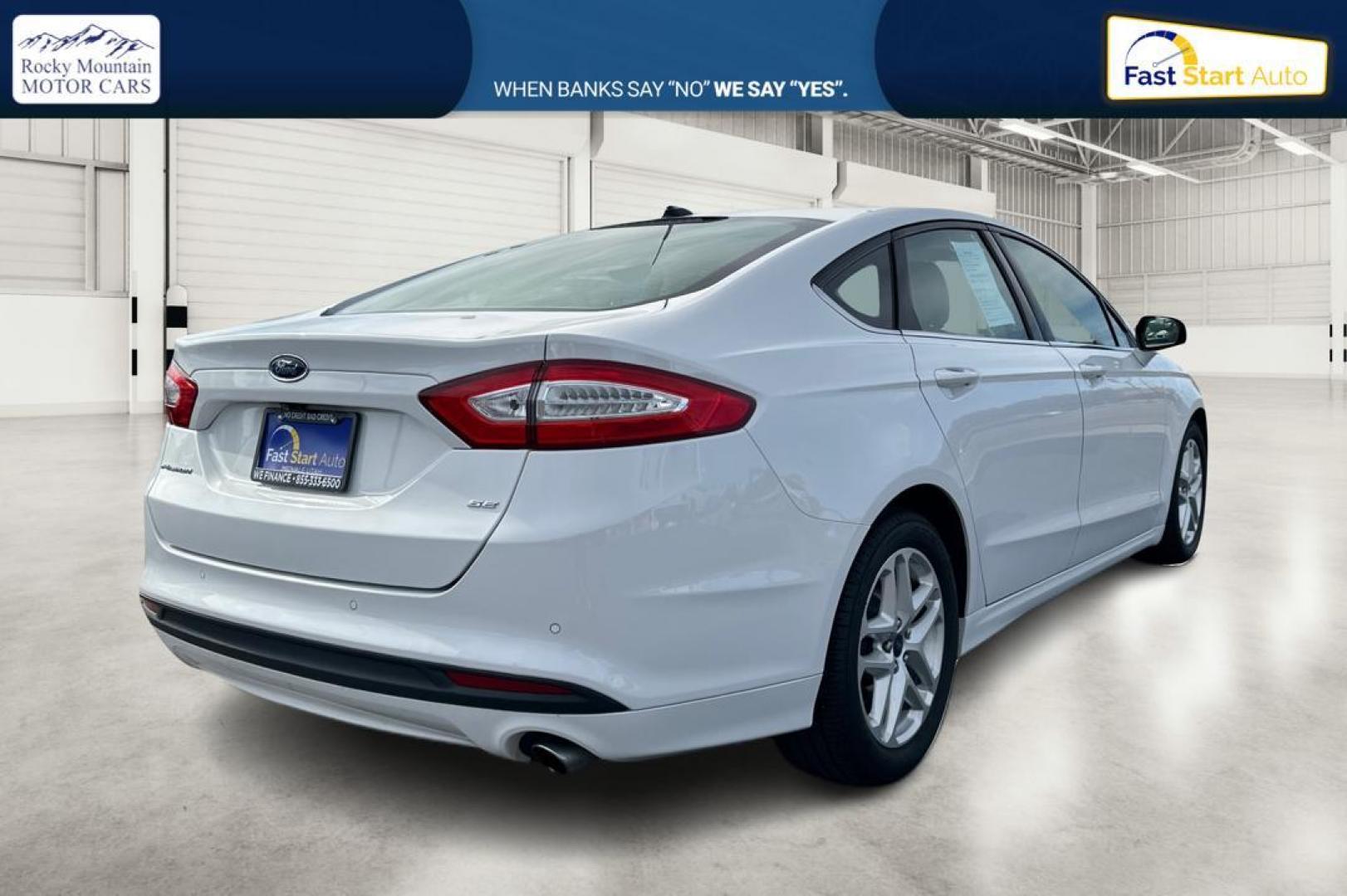 2016 White Ford Fusion SE (3FA6P0H77GR) with an 2.5L L4 DOHC 16V engine, 6-Speed Automatic transmission, located at 7755 State Street, Midvale, UT, 84047, (801) 753-9063, 40.610329, -111.892159 - Photo#2