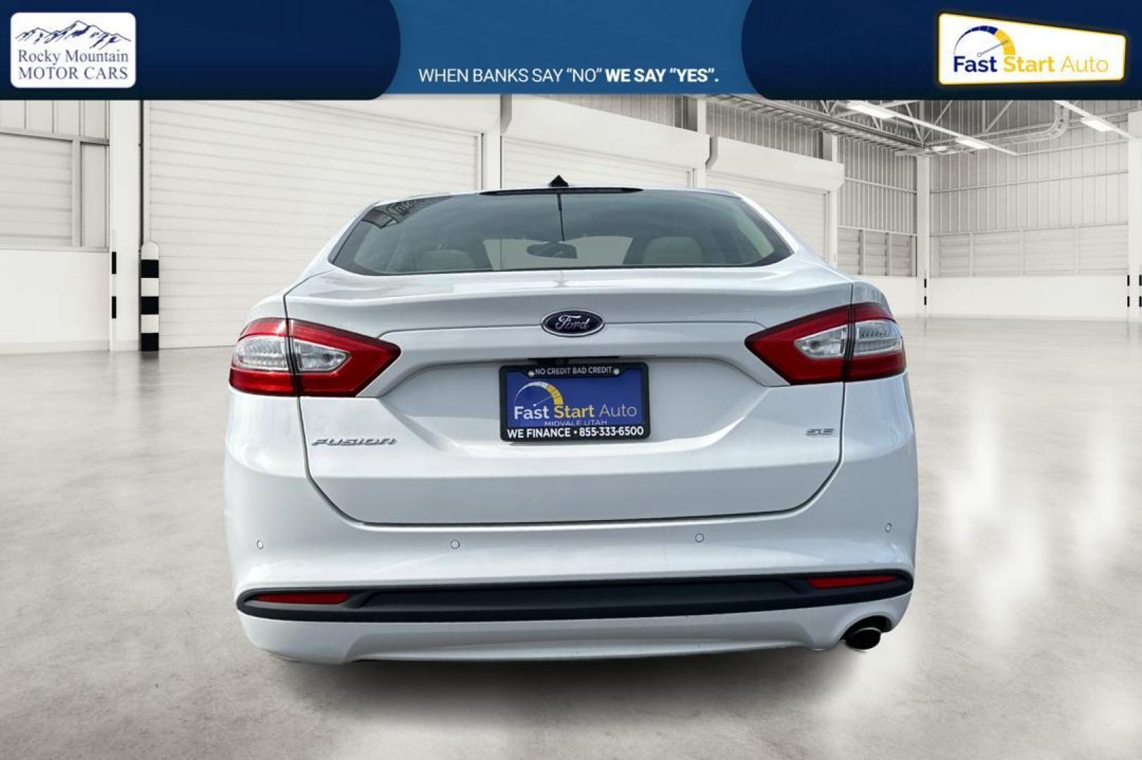 2016 White Ford Fusion SE (3FA6P0H77GR) with an 2.5L L4 DOHC 16V engine, 6-Speed Automatic transmission, located at 7755 State Street, Midvale, UT, 84047, (801) 753-9063, 40.610329, -111.892159 - Photo#4