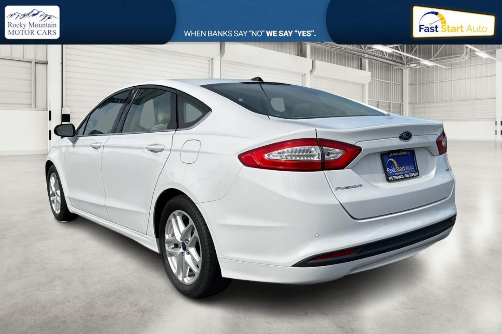 2016 White Ford Fusion SE (3FA6P0H77GR) with an 2.5L L4 DOHC 16V engine, 6-Speed Automatic transmission, located at 7755 State Street, Midvale, UT, 84047, (801) 753-9063, 40.610329, -111.892159 - Photo#5