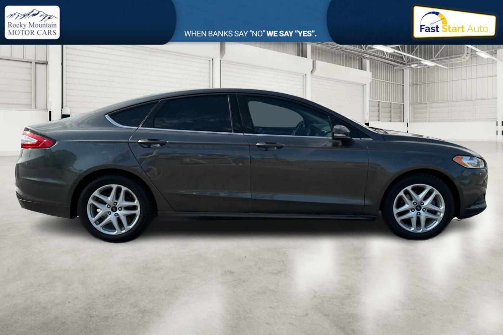 2016 Gray Ford Fusion SE (3FA6P0H7XGR) with an 2.5L L4 DOHC 16V engine, 6-Speed Automatic transmission, located at 7755 State Street, Midvale, UT, 84047, (801) 753-9063, 40.610329, -111.892159 - Photo#1