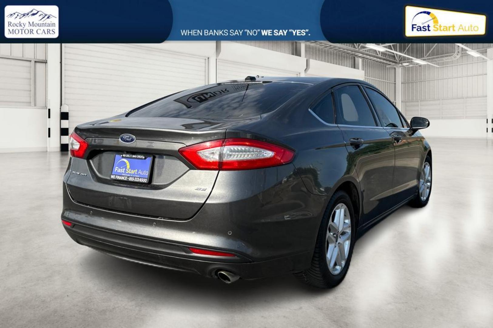 2016 Gray Ford Fusion SE (3FA6P0H7XGR) with an 2.5L L4 DOHC 16V engine, 6-Speed Automatic transmission, located at 7755 State Street, Midvale, UT, 84047, (801) 753-9063, 40.610329, -111.892159 - Photo#2