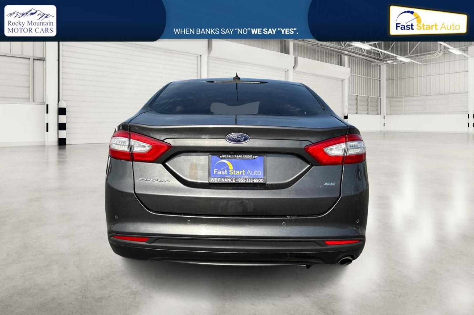 2016 Gray Ford Fusion SE (3FA6P0H7XGR) with an 2.5L L4 DOHC 16V engine, 6-Speed Automatic transmission, located at 7755 State Street, Midvale, UT, 84047, (801) 753-9063, 40.610329, -111.892159 - Photo#3