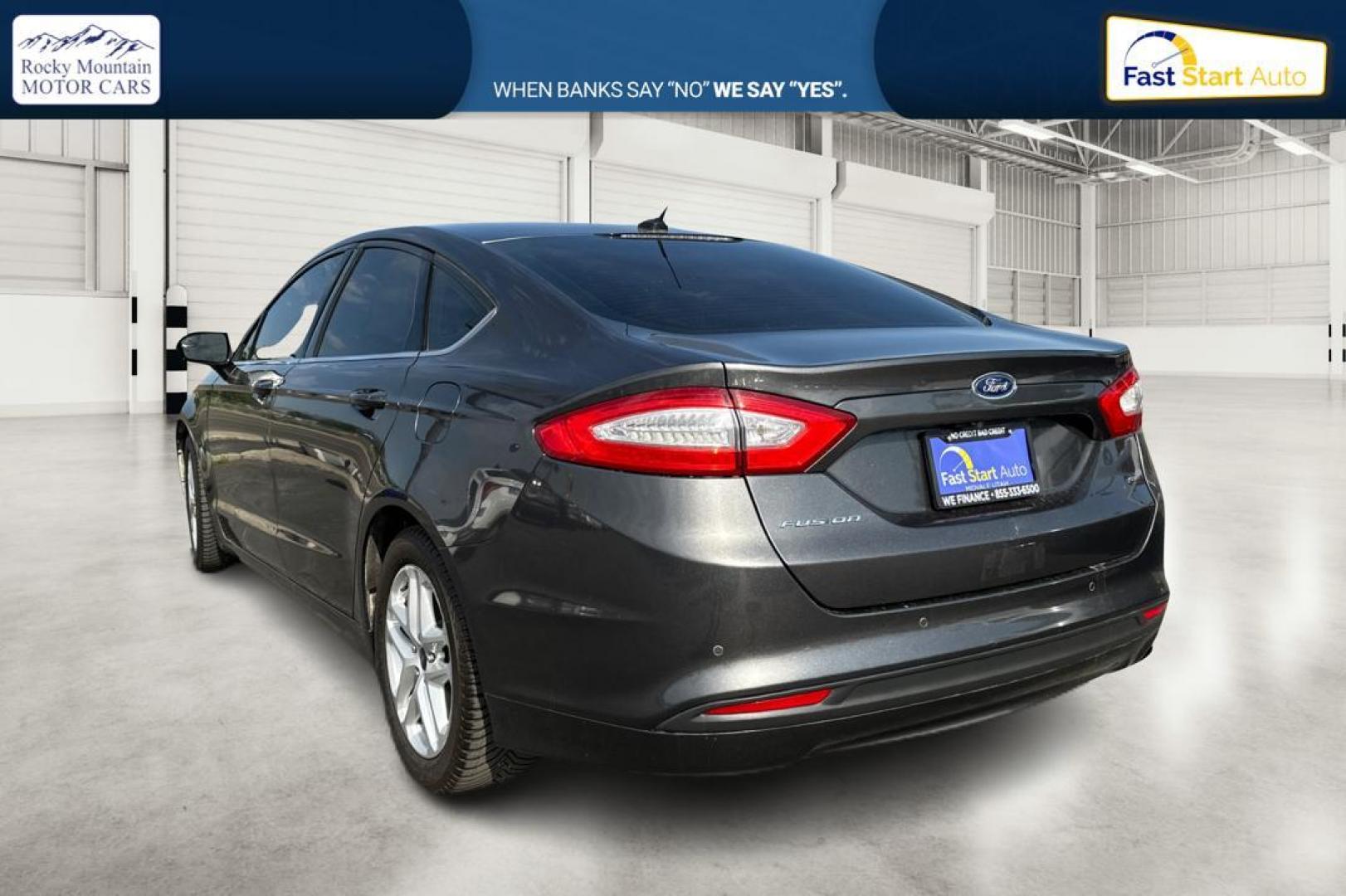 2016 Gray Ford Fusion SE (3FA6P0H7XGR) with an 2.5L L4 DOHC 16V engine, 6-Speed Automatic transmission, located at 7755 State Street, Midvale, UT, 84047, (801) 753-9063, 40.610329, -111.892159 - Photo#4