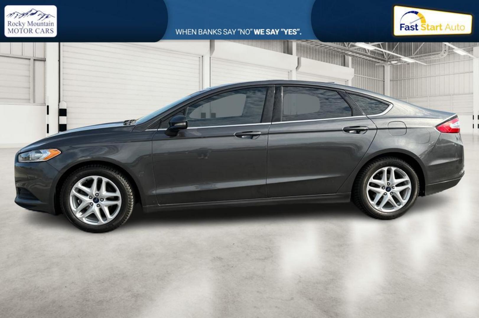 2016 Gray Ford Fusion SE (3FA6P0H7XGR) with an 2.5L L4 DOHC 16V engine, 6-Speed Automatic transmission, located at 7755 State Street, Midvale, UT, 84047, (801) 753-9063, 40.610329, -111.892159 - Photo#5