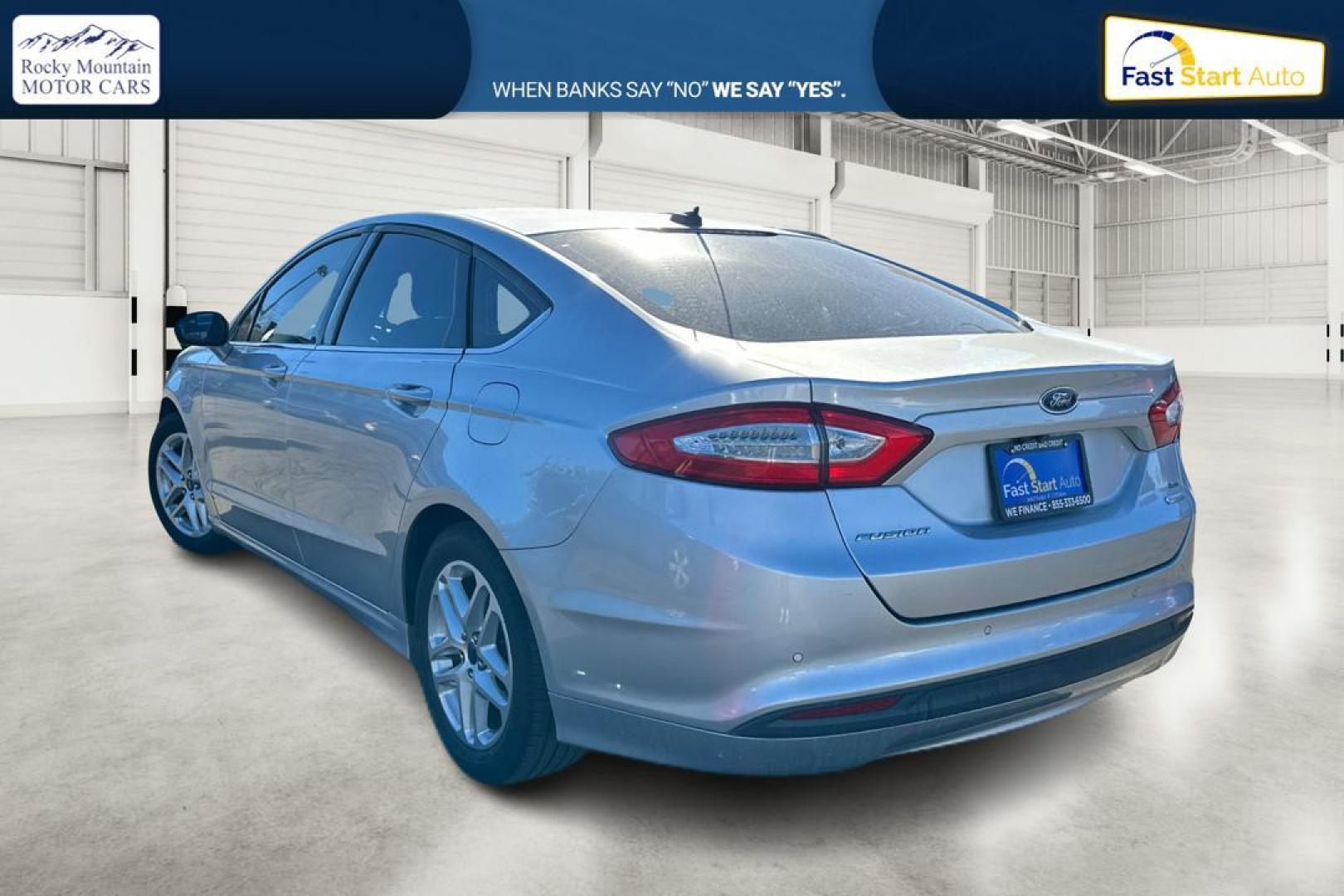 2016 Silver Ford Fusion SE (3FA6P0HD4GR) with an 1.5L L4 DOHC 16V engine, 6-Speed Automatic transmission, located at 344 S Washington Blvd, Ogden, UT, 84404, (801) 399-1799, 41.255482, -111.970848 - Photo#4