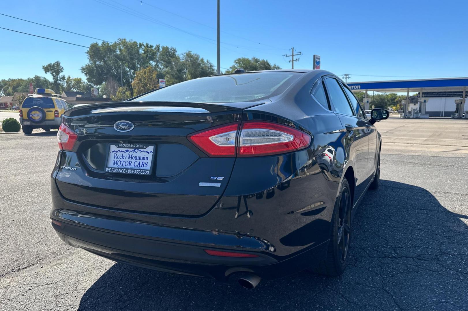 2016 Black Ford Fusion SE (3FA6P0HD8GR) with an 1.5L L4 DOHC 16V engine, 6-Speed Automatic transmission, located at 344 S Washington Blvd, Ogden, UT, 84404, (801) 399-1799, 41.255482, -111.970848 - Photo#2