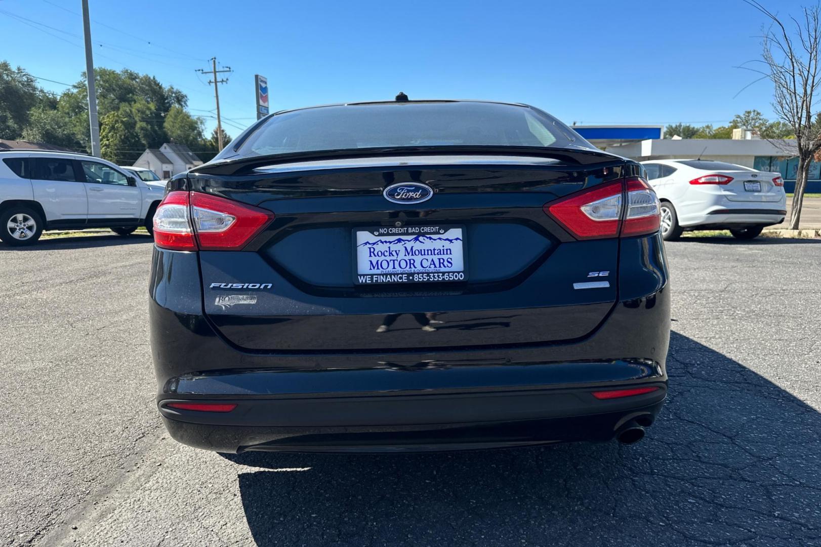 2016 Black Ford Fusion SE (3FA6P0HD8GR) with an 1.5L L4 DOHC 16V engine, 6-Speed Automatic transmission, located at 344 S Washington Blvd, Ogden, UT, 84404, (801) 399-1799, 41.255482, -111.970848 - Photo#3