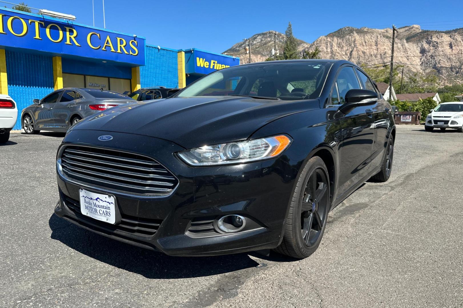 2016 Black Ford Fusion SE (3FA6P0HD8GR) with an 1.5L L4 DOHC 16V engine, 6-Speed Automatic transmission, located at 344 S Washington Blvd, Ogden, UT, 84404, (801) 399-1799, 41.255482, -111.970848 - Photo#6