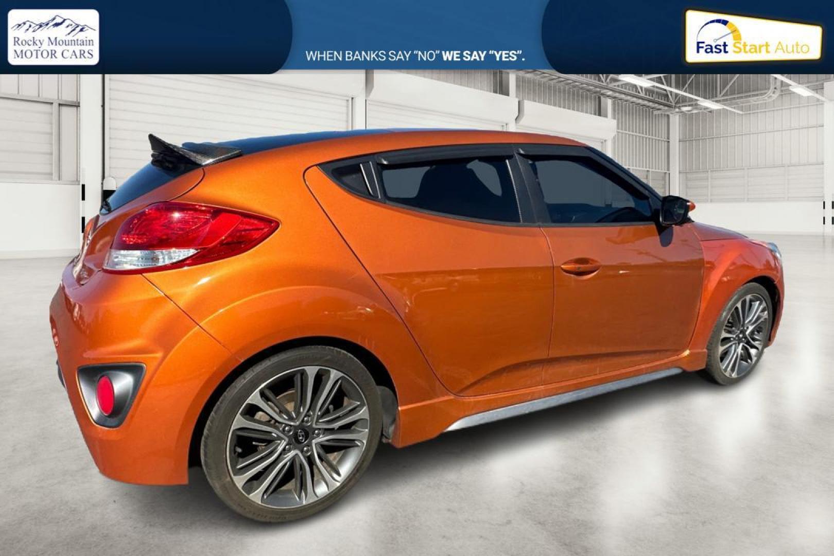 2016 Orange Hyundai Veloster Turbo 6MT (KMHTC6AE4GU) with an 1.6L L4 DOHC 16V TURBO engine, 6M transmission, located at 7755 State Street, Midvale, UT, 84047, (801) 753-9063, 40.610329, -111.892159 - Photo#2