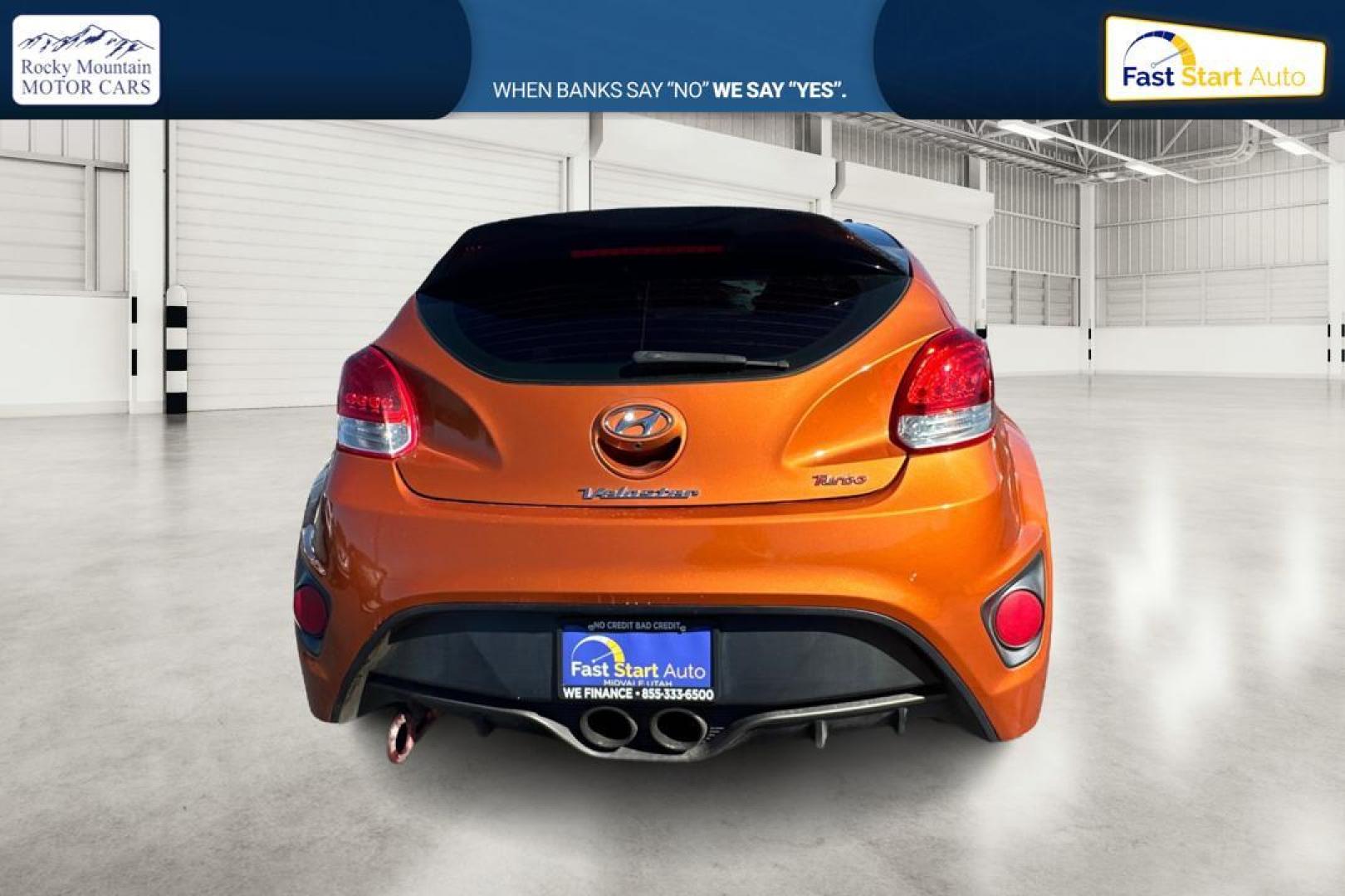 2016 Orange Hyundai Veloster Turbo 6MT (KMHTC6AE4GU) with an 1.6L L4 DOHC 16V TURBO engine, 6M transmission, located at 7755 State Street, Midvale, UT, 84047, (801) 753-9063, 40.610329, -111.892159 - Photo#3