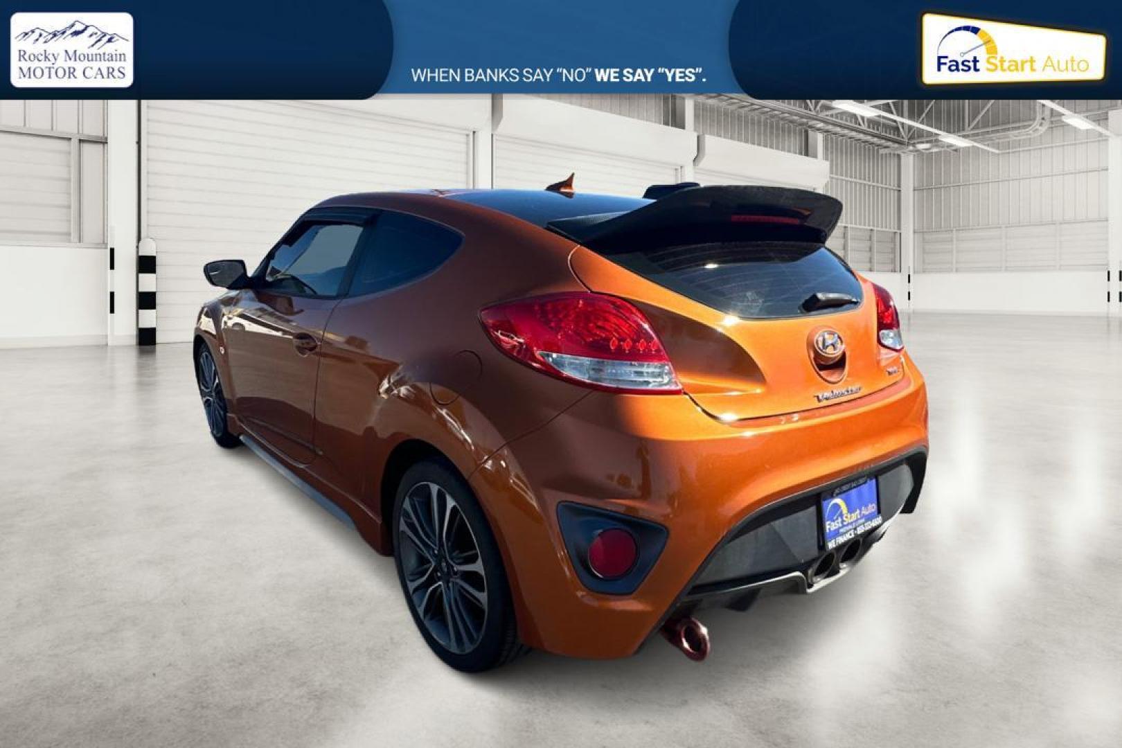 2016 Orange Hyundai Veloster Turbo 6MT (KMHTC6AE4GU) with an 1.6L L4 DOHC 16V TURBO engine, 6M transmission, located at 7755 State Street, Midvale, UT, 84047, (801) 753-9063, 40.610329, -111.892159 - Photo#4