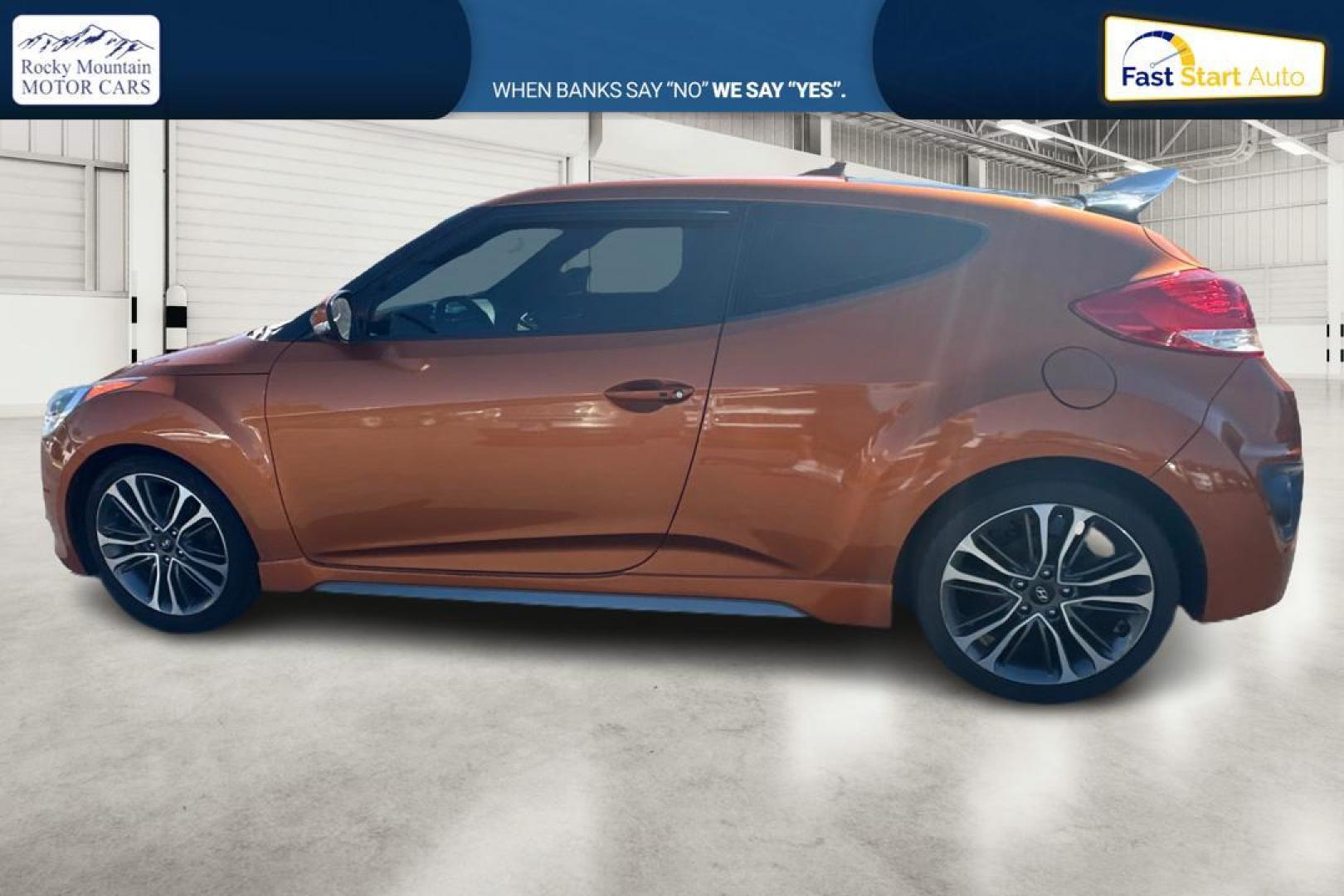 2016 Orange Hyundai Veloster Turbo 6MT (KMHTC6AE4GU) with an 1.6L L4 DOHC 16V TURBO engine, 6M transmission, located at 7755 State Street, Midvale, UT, 84047, (801) 753-9063, 40.610329, -111.892159 - Photo#5