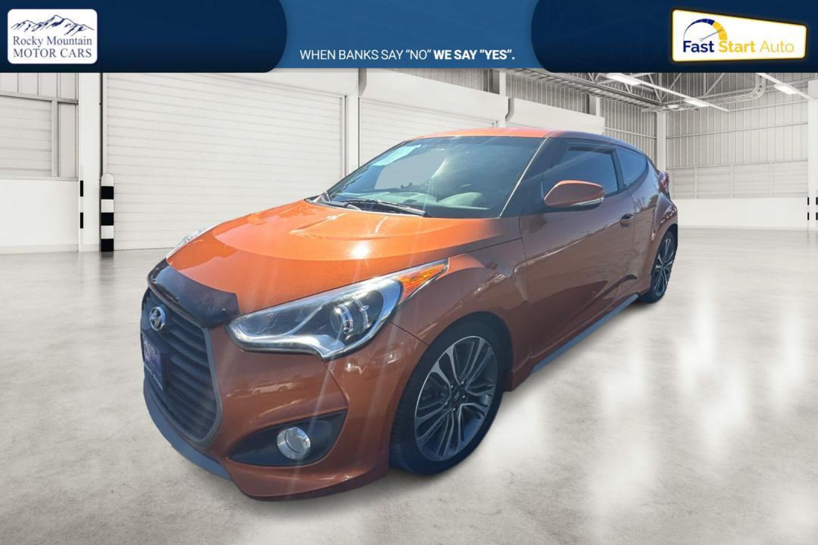 2016 Orange Hyundai Veloster Turbo 6MT (KMHTC6AE4GU) with an 1.6L L4 DOHC 16V TURBO engine, 6M transmission, located at 7755 State Street, Midvale, UT, 84047, (801) 753-9063, 40.610329, -111.892159 - Photo#6