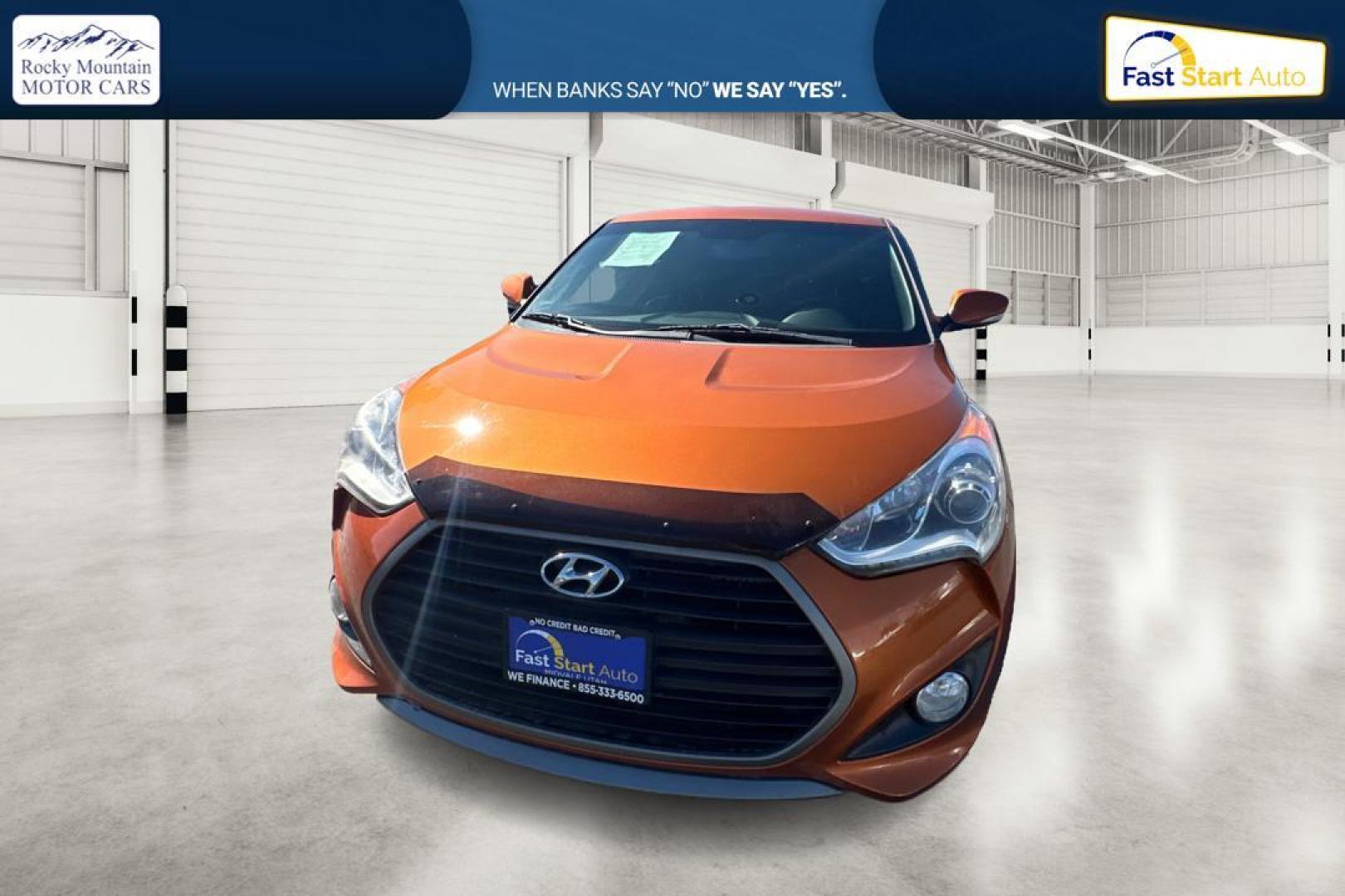 2016 Orange Hyundai Veloster Turbo 6MT (KMHTC6AE4GU) with an 1.6L L4 DOHC 16V TURBO engine, 6M transmission, located at 7755 State Street, Midvale, UT, 84047, (801) 753-9063, 40.610329, -111.892159 - Photo#7