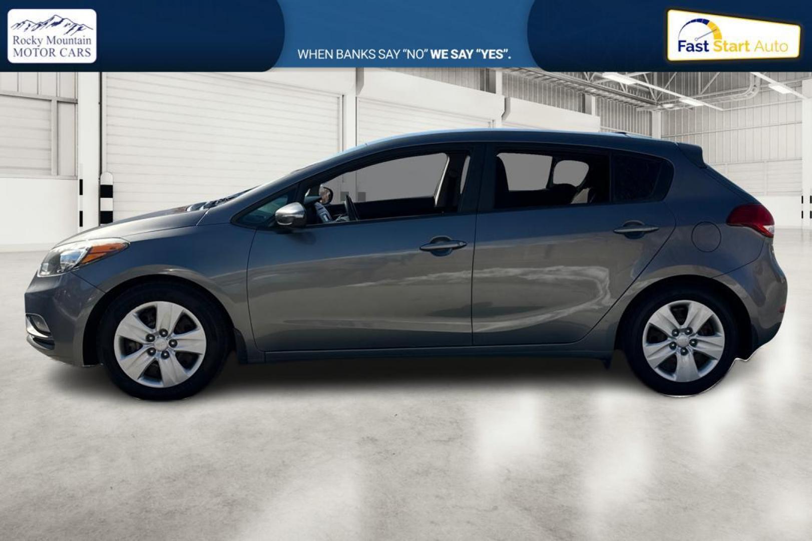 2016 Gray Kia Forte 5-Door LX (KNAFK5A87G5) with an 2.0L L4 DOHC 16V engine, 6-Speed Automatic transmission, located at 767 S State Road, Pleasant Grove, UT, 84062, (801) 785-1058, 40.354839, -111.736687 - Photo#6