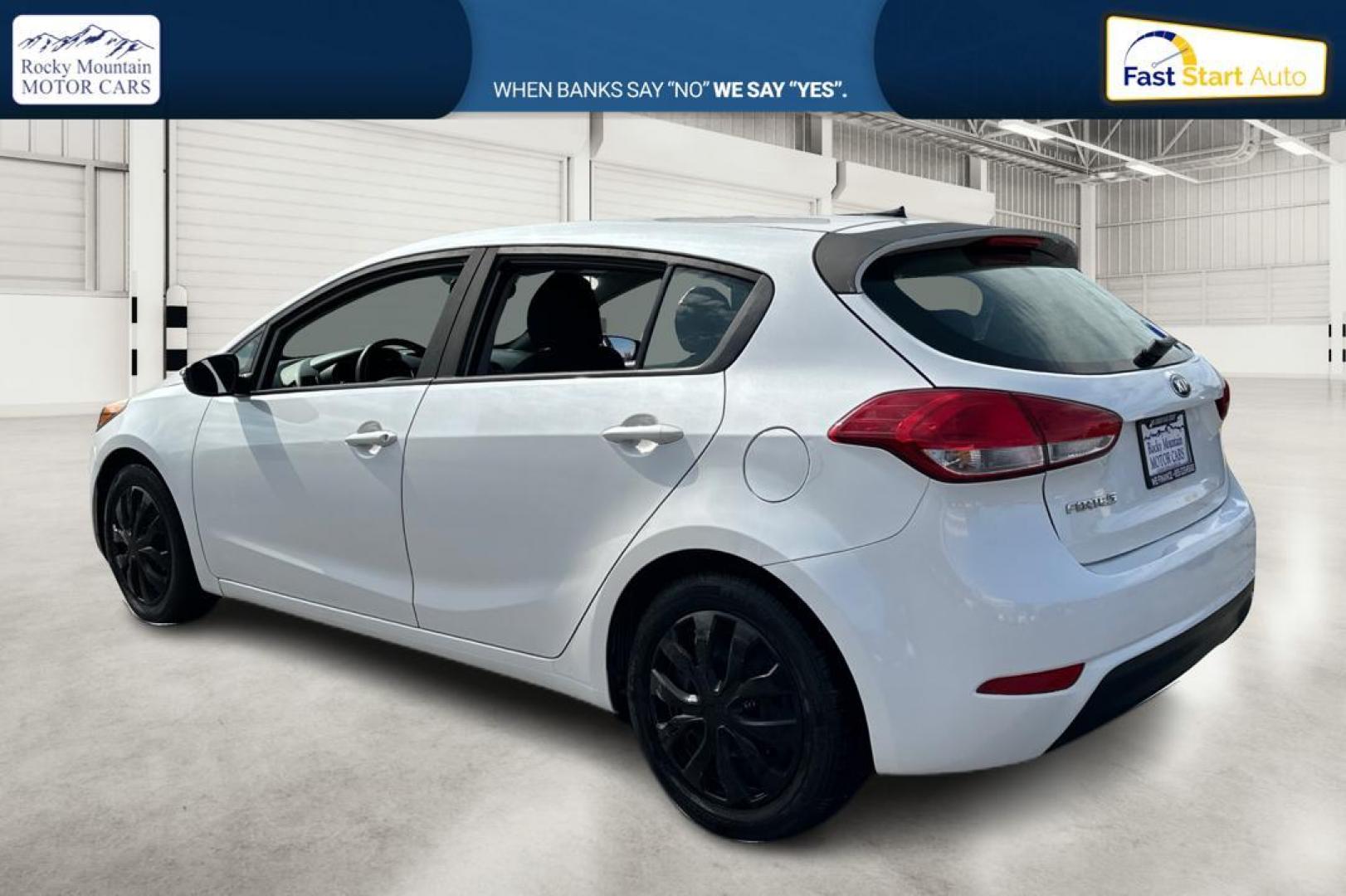 2016 White Kia Forte 5-Door LX (KNAFK5A84G5) with an 2.0L L4 DOHC 16V engine, 6-Speed Automatic transmission, located at 344 S Washington Blvd, Ogden, UT, 84404, (801) 399-1799, 41.255482, -111.970848 - Photo#5