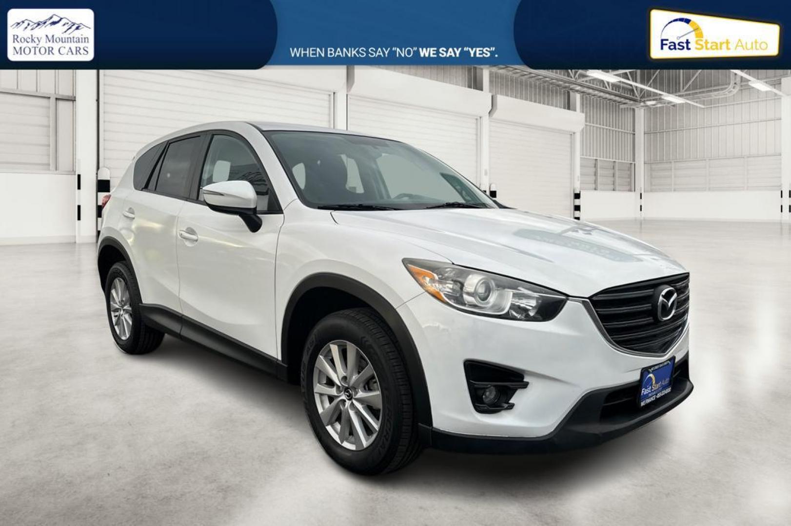 2016 White Mazda CX-5 Touring (JM3KE2CY5G0) with an 2.5L L4 DOHC 16V engine, 6-Speed Automatic transmission, located at 767 S State Road, Pleasant Grove, UT, 84062, (801) 785-1058, 40.354839, -111.736687 - Photo#0