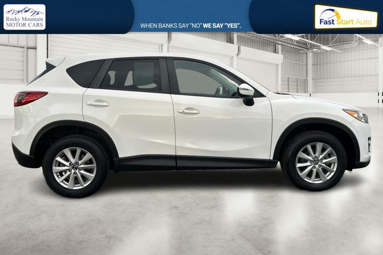 2016 White Mazda CX-5 Touring (JM3KE2CY5G0) with an 2.5L L4 DOHC 16V engine, 6-Speed Automatic transmission, located at 767 S State Road, Pleasant Grove, UT, 84062, (801) 785-1058, 40.354839, -111.736687 - Photo#1